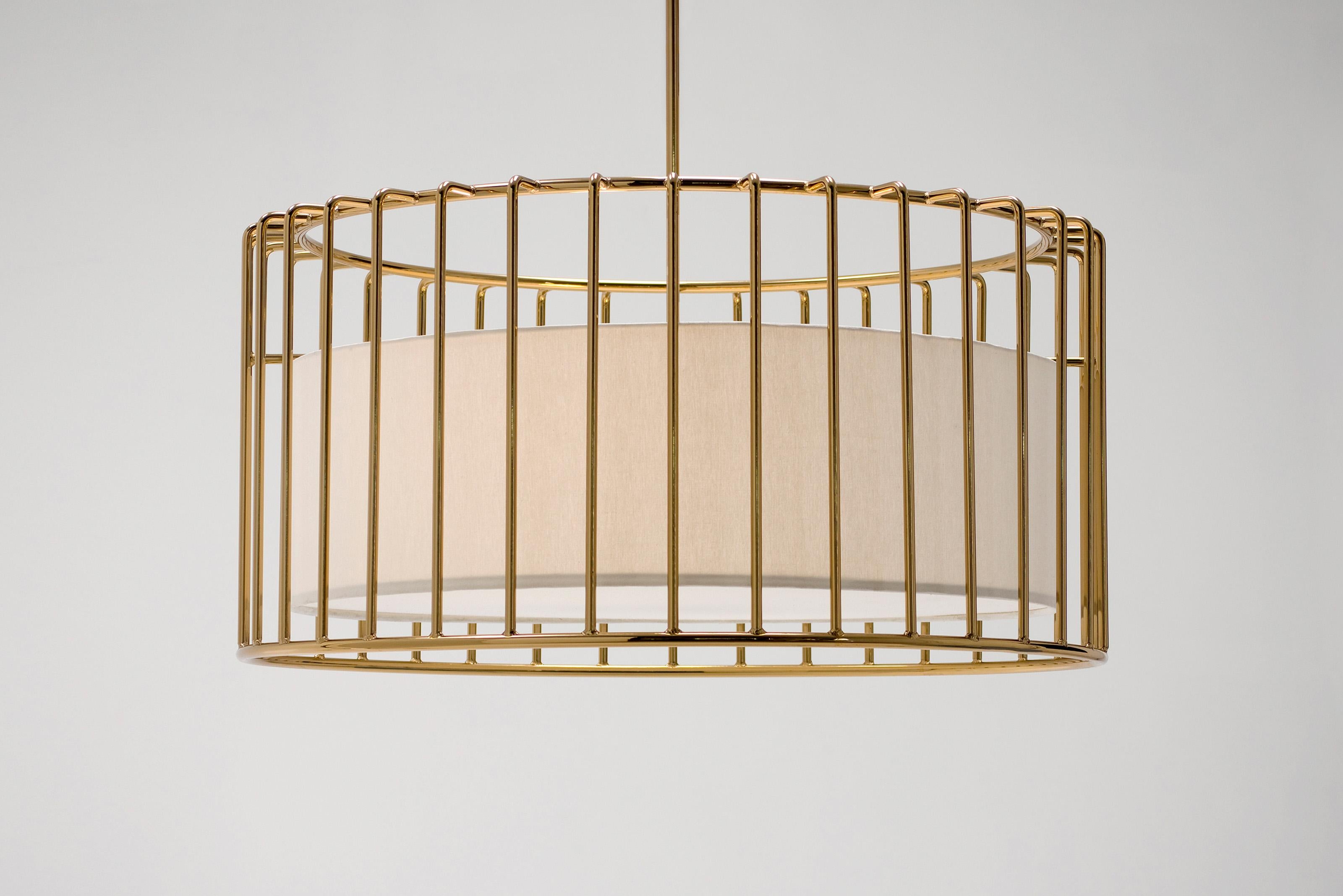 Inner Beauty Chandelier by Phase Design
Dimensions: Ø 81.3 x H 40.6 cm. 
Materials: Linen and smoked brass.

Solid steel bar available in a smoked brass, polished chrome, burnt copper, gloss or flat black and white powder coat. Powder coat finishes