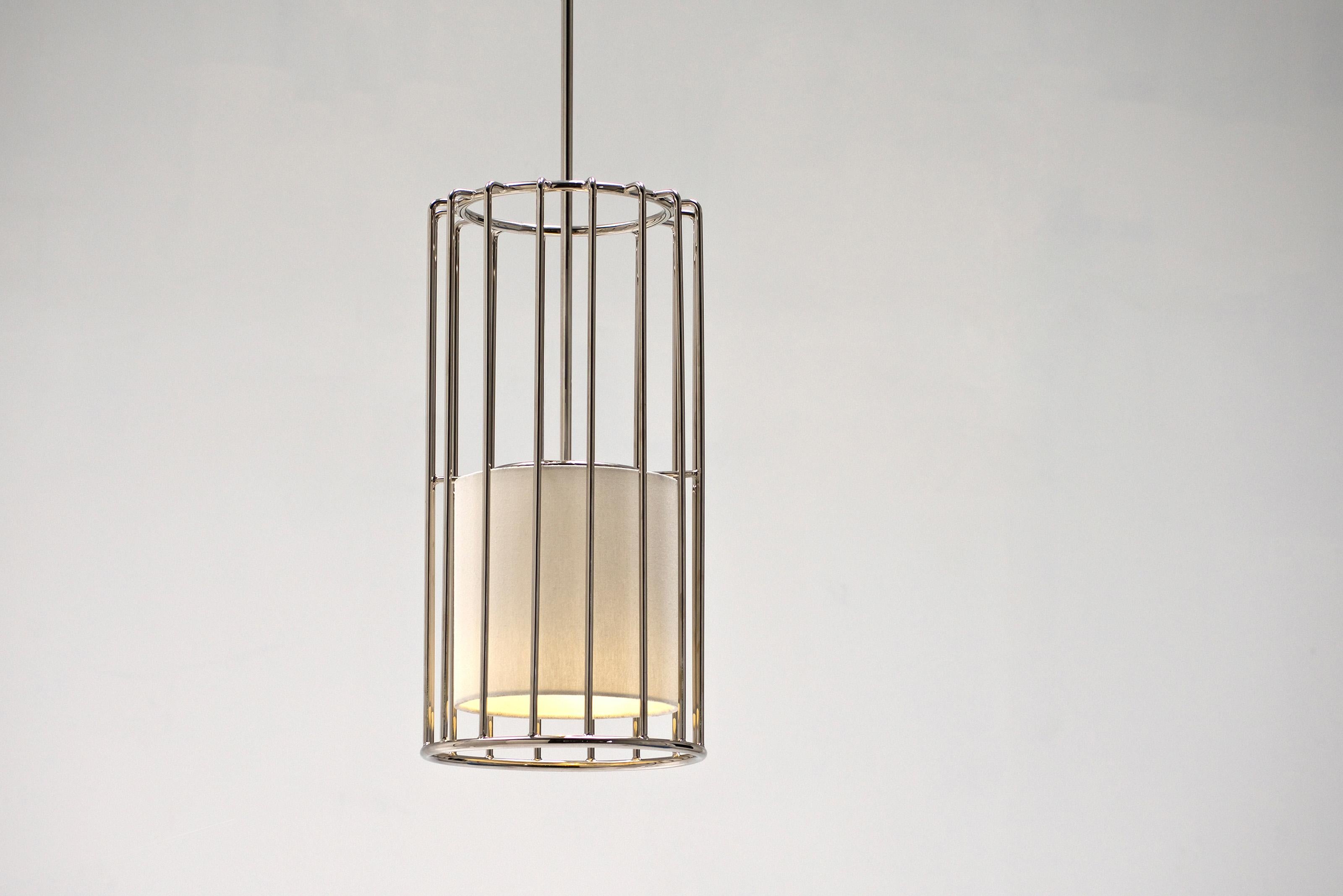 Inner Beauty Pendant Light by Phase Design
Dimensions: Ø 22.9 x H 45.7 cm. 
Materials: Linen and polished chrome.

Solid steel bar available in a smoked brass, polished chrome, burnt copper, gloss or flat black and white powder coat. Powder coat