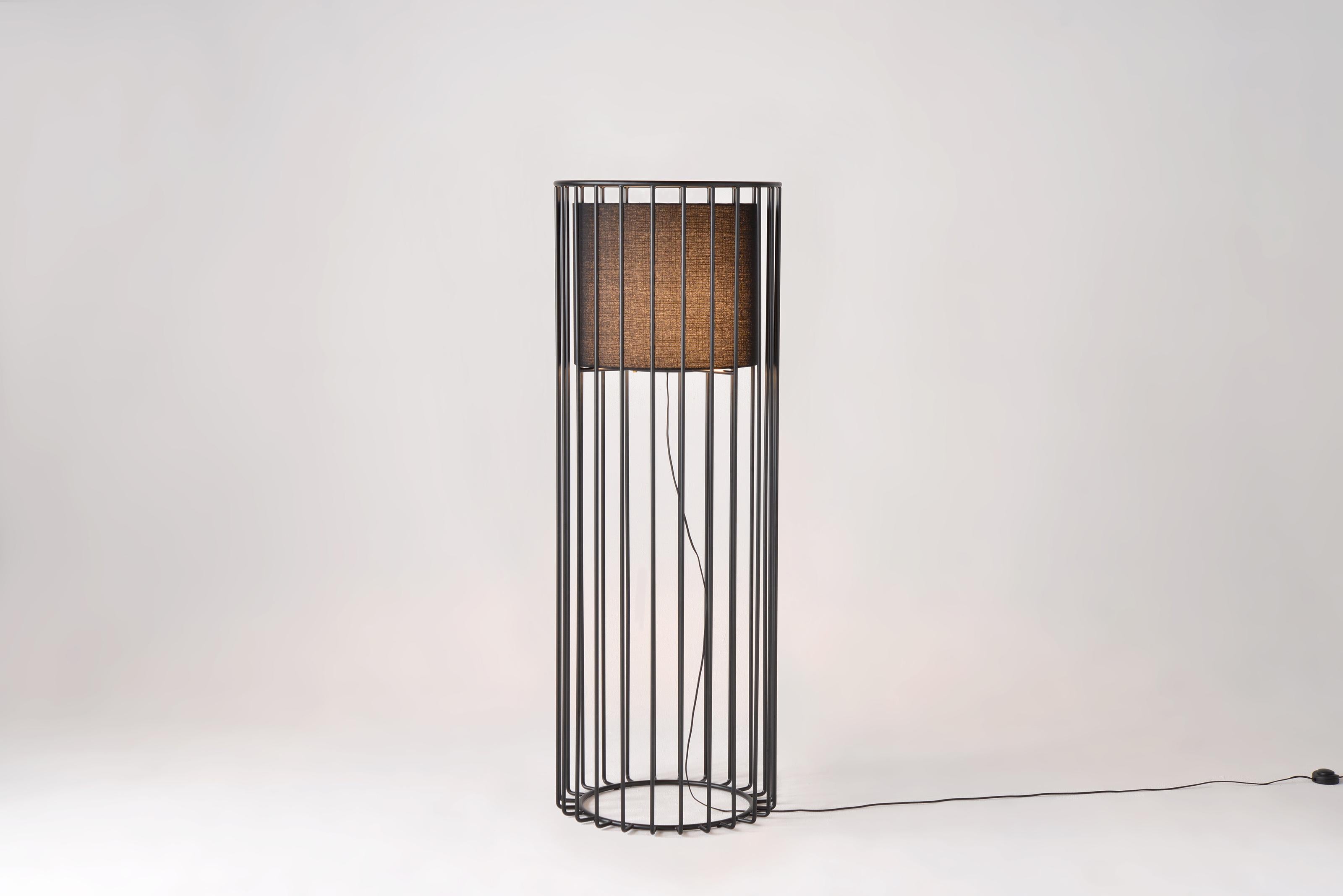 Inner Beauty Tall Floor Light by Phase Design
Dimensions: Ø 61 x H 182.9 cm. 
Materials: Black linen and powder-coated metal.

Solid steel bar available in a smoked brass, polished chrome, burnt copper, gloss or flat black and white powder coat.