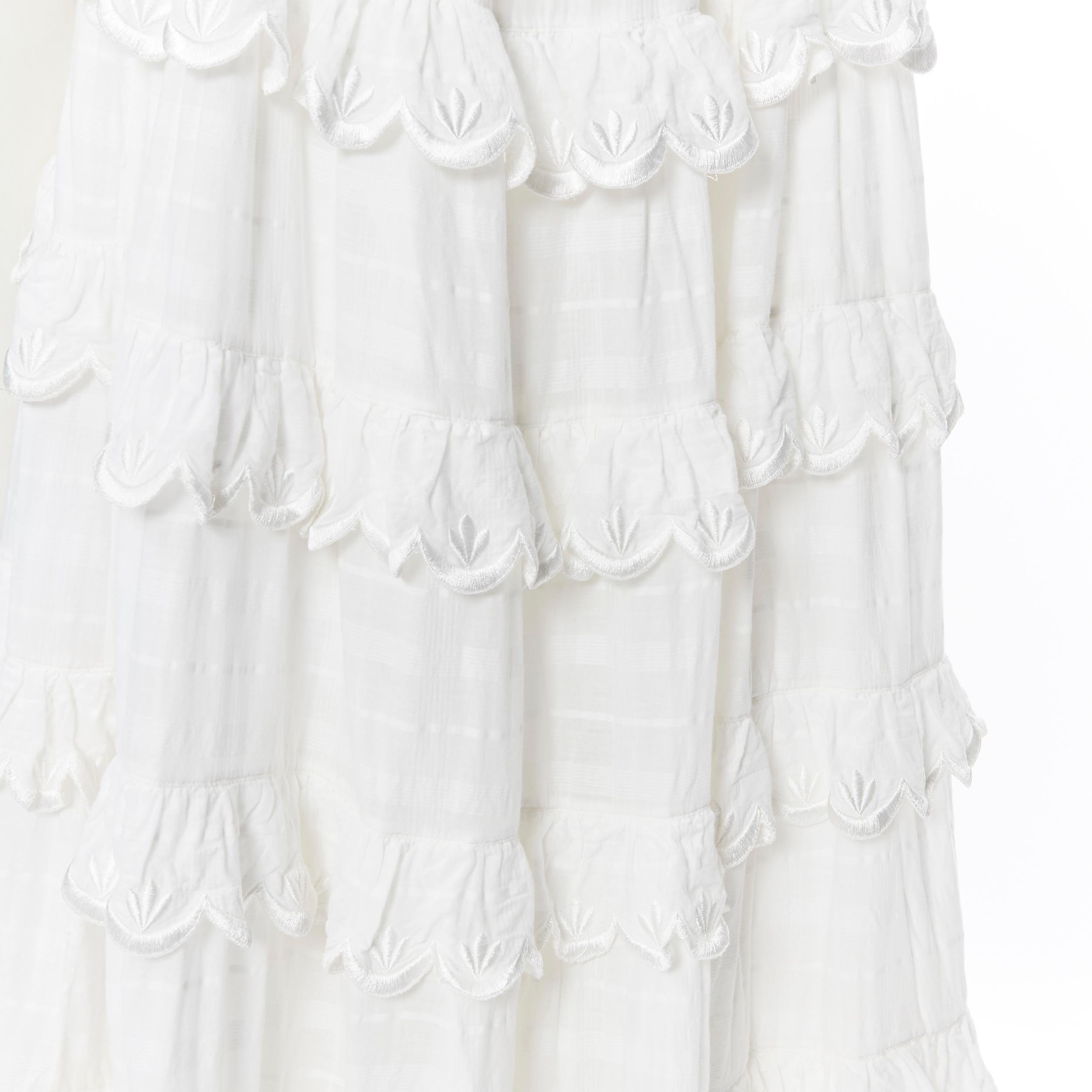 INNIKA CHOO white cotton embroidered scallop petal tiered bohemian tent dress
Brand: Innika Choo
Designer: Innika Choo
Model Name / Style: Bohemian Dress
Material: Other; feels like cotton
Color: White
Pattern: Solid
Extra Detail: Sleeveless. Wide