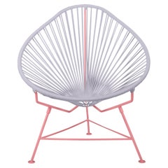 Innit Designs fauteuil Acapulco tissé transparent sur cadre corail