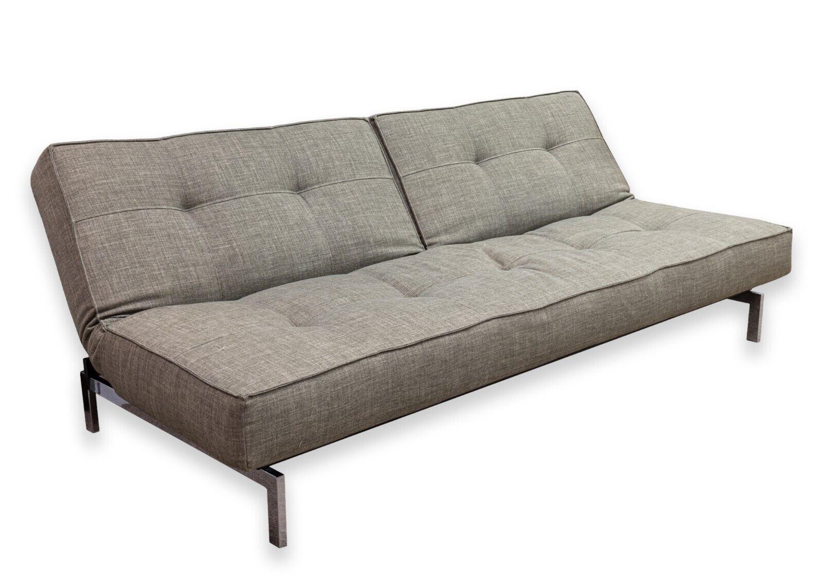 An Innovation Living Dublexo stainless steel sofa bed, made in Denmark. A gorgeous contemporary modern lounge sofa from designer Per Weiss in 2011, lead designer at Innovation Living. This piece features an adjustable back with 3 different positions