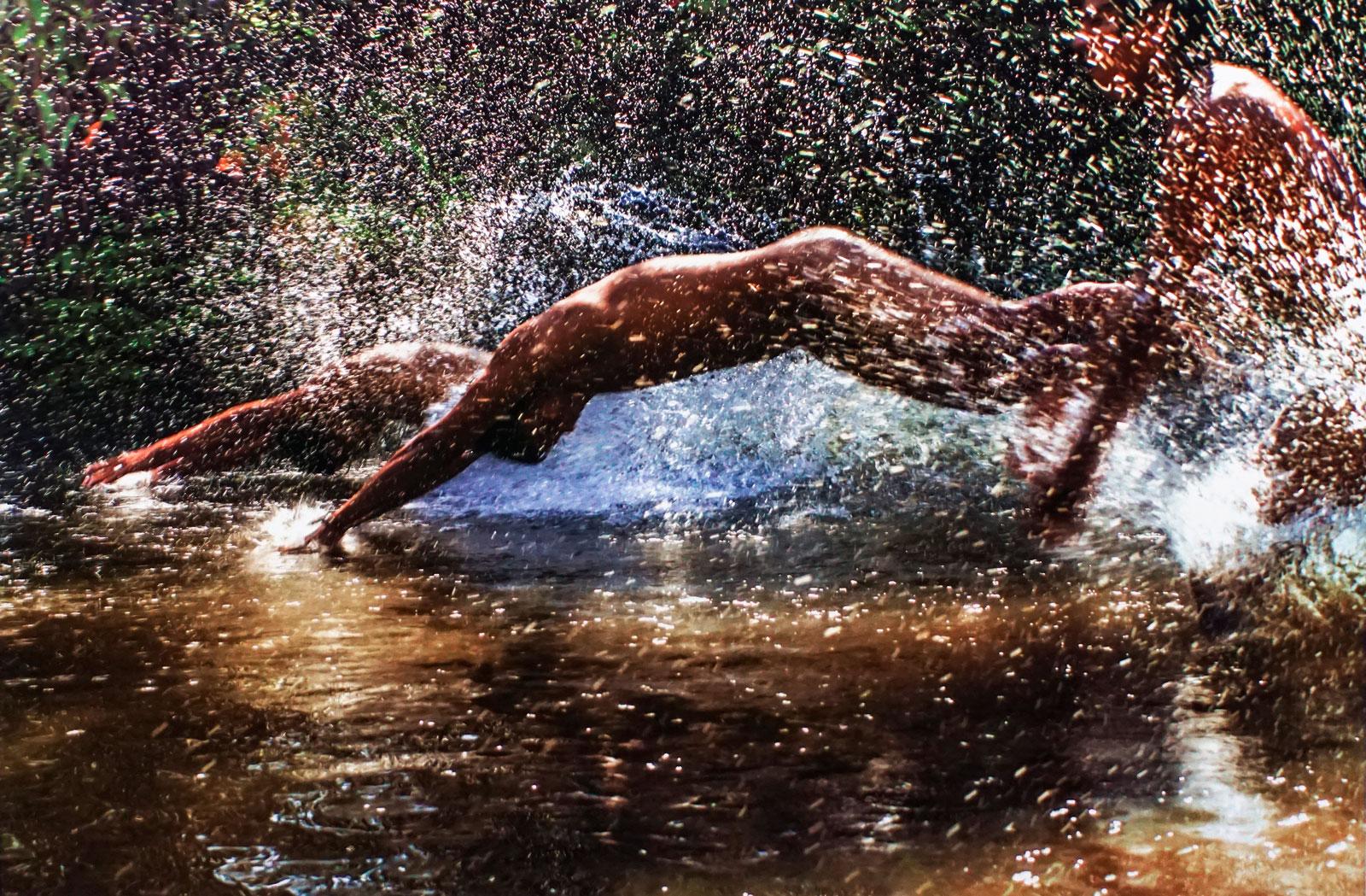 The Boys Splash ( Playful nude boys splash, dive into river in Iquitos, Peru) - Photograph by Inon Sani