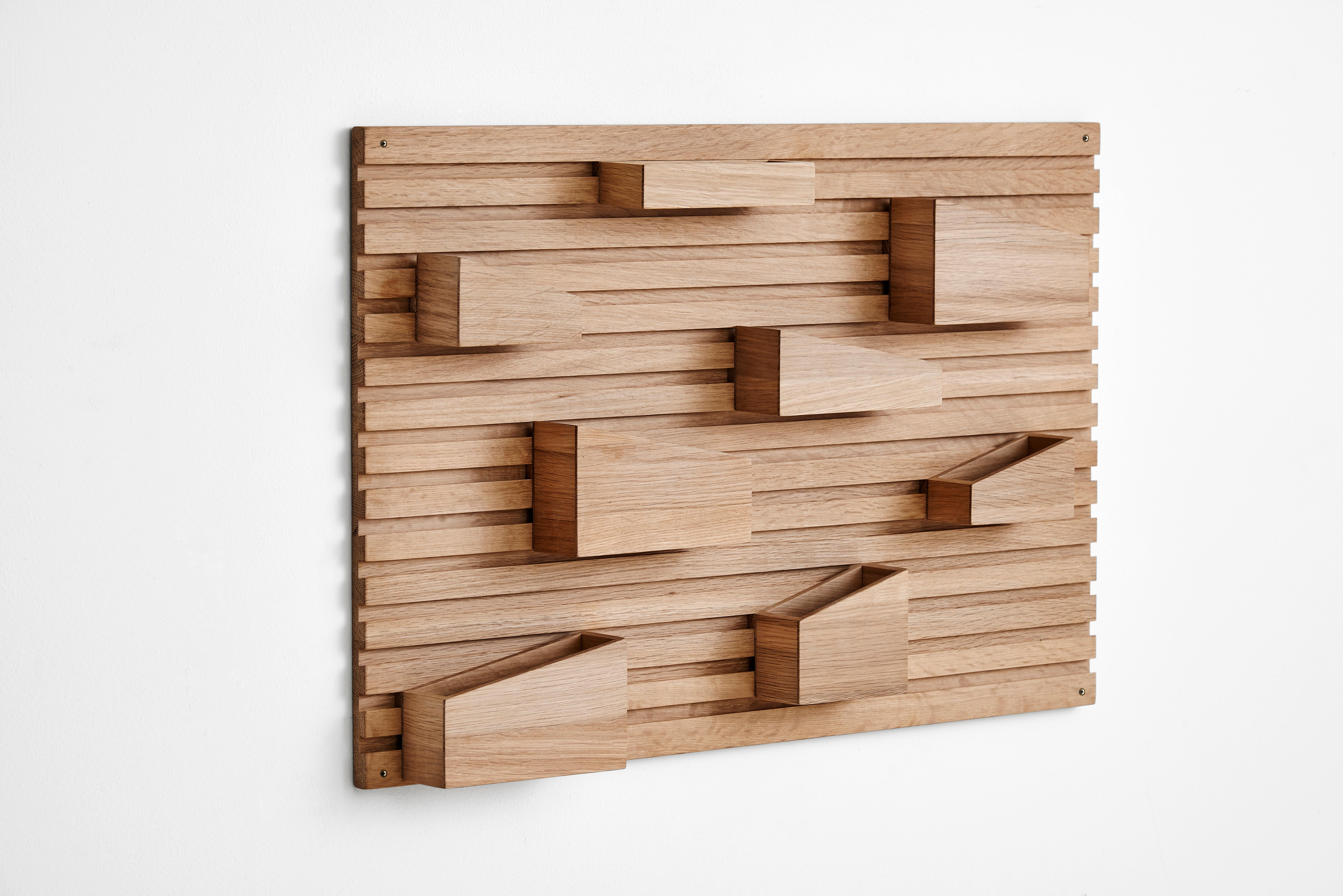 Input organiser by Anne Holm and Sigrid Smetana.
Materials: oak.
Dimensions: D 6.5 x W 66 x H 44 cm.

Input is a flexible organiser with eight movable boxes in different dimensions and shapes. Allowing you to create the exact expression you want