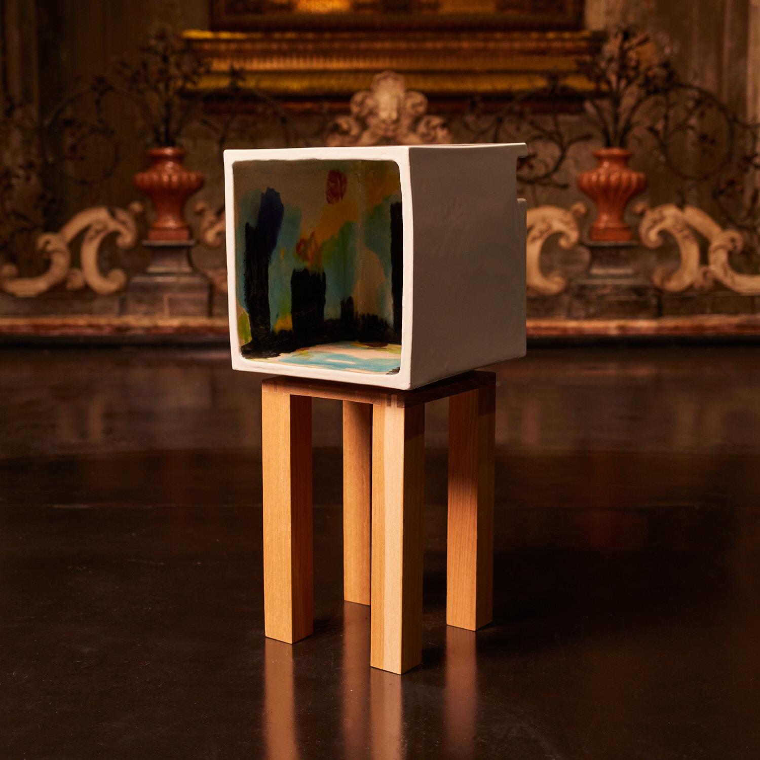 InQuadrato is a series of open cabinets, intended to be used as bed sides, offered in three different heights, each one is a unique piece painted by the artist. Sturdy and pictorial in taste, these ceramic cube cabinets presents considerable
