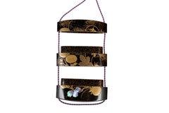 Inro in black and gold lacquer with a proeminent chrysantemum flower motive