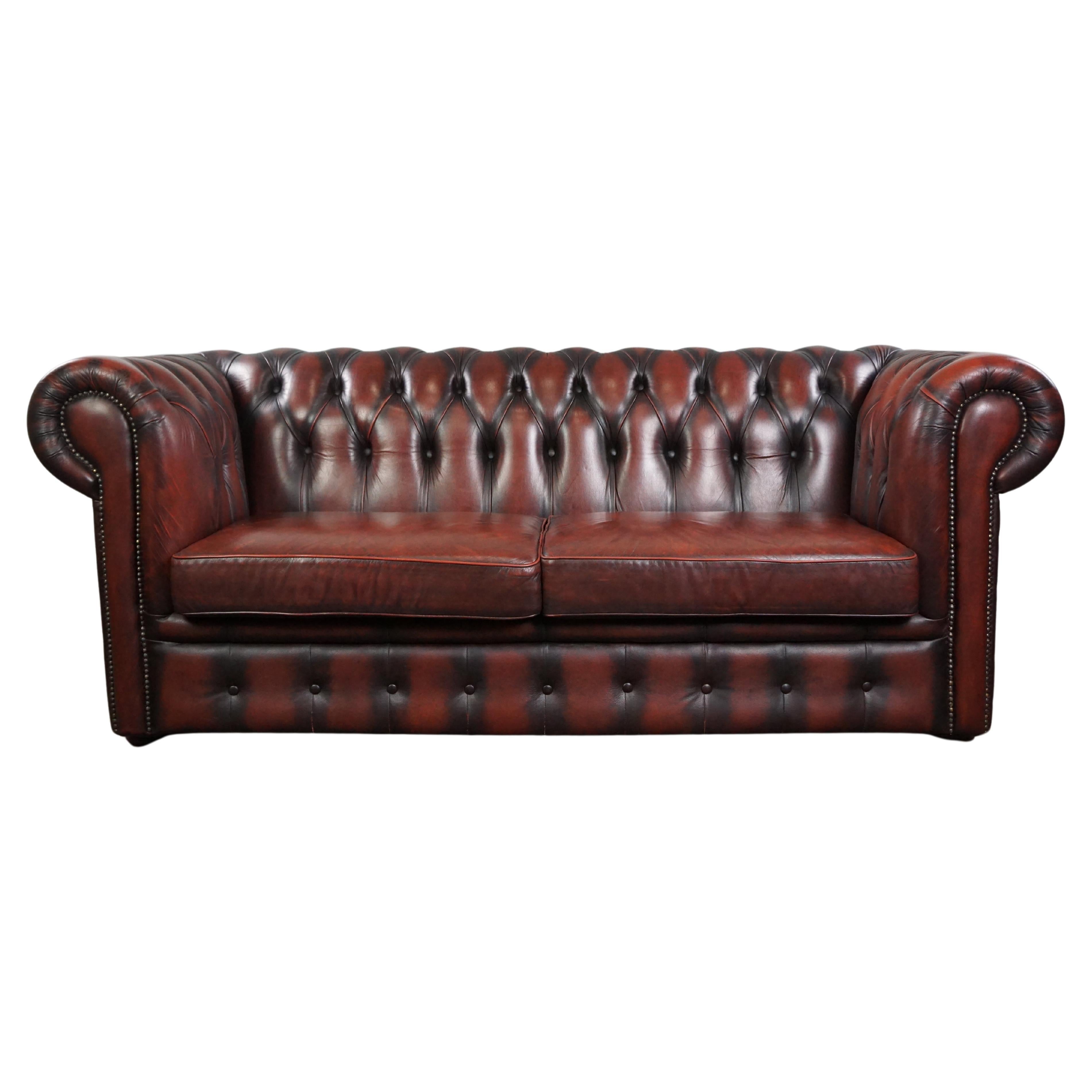 Insanely colored red cow leather Chesterfield sofa, spacious 2 seater For Sale