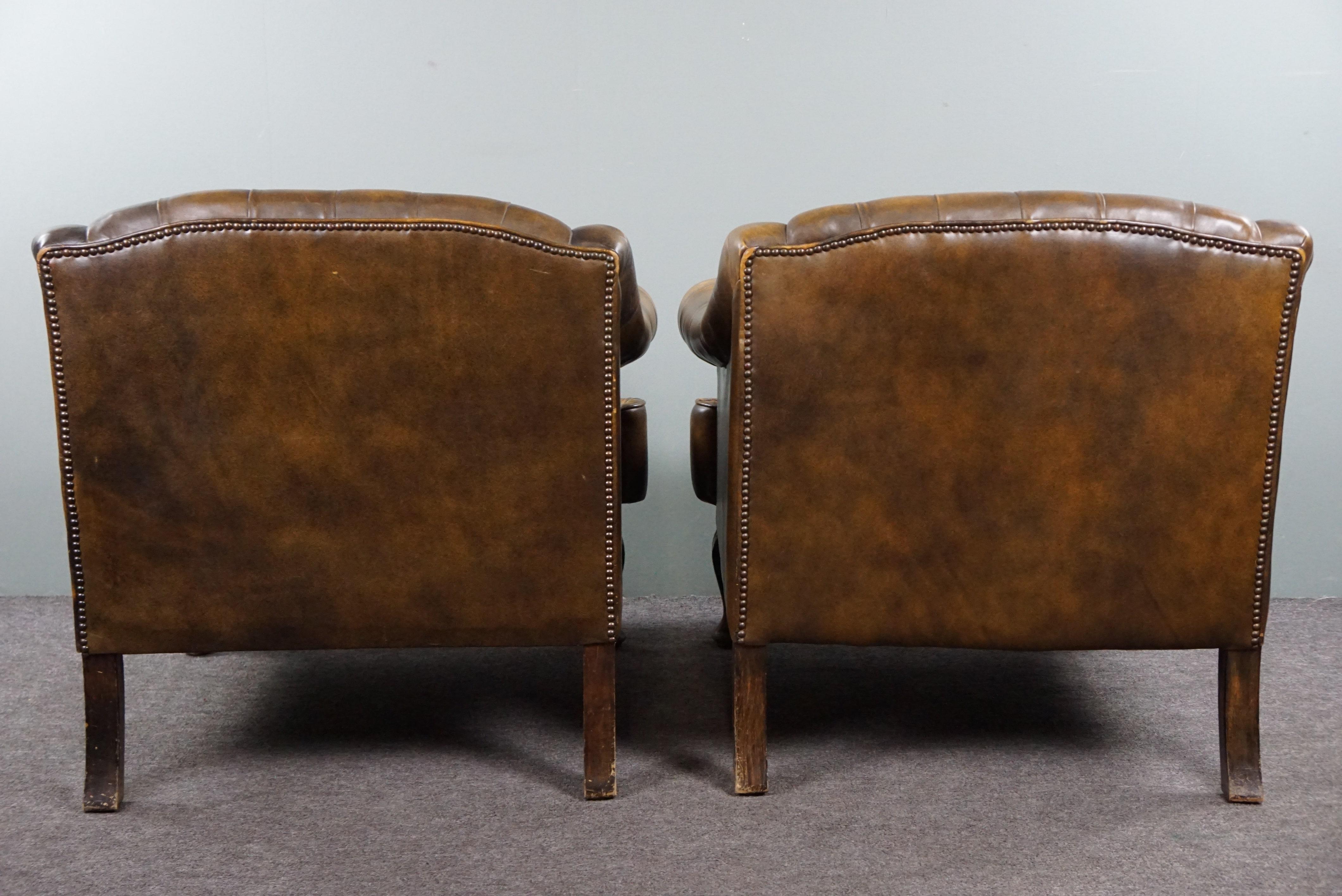 Cowhide Insanely unique set of two cowhide leather Chesterfield armchairs/arm chairs For Sale