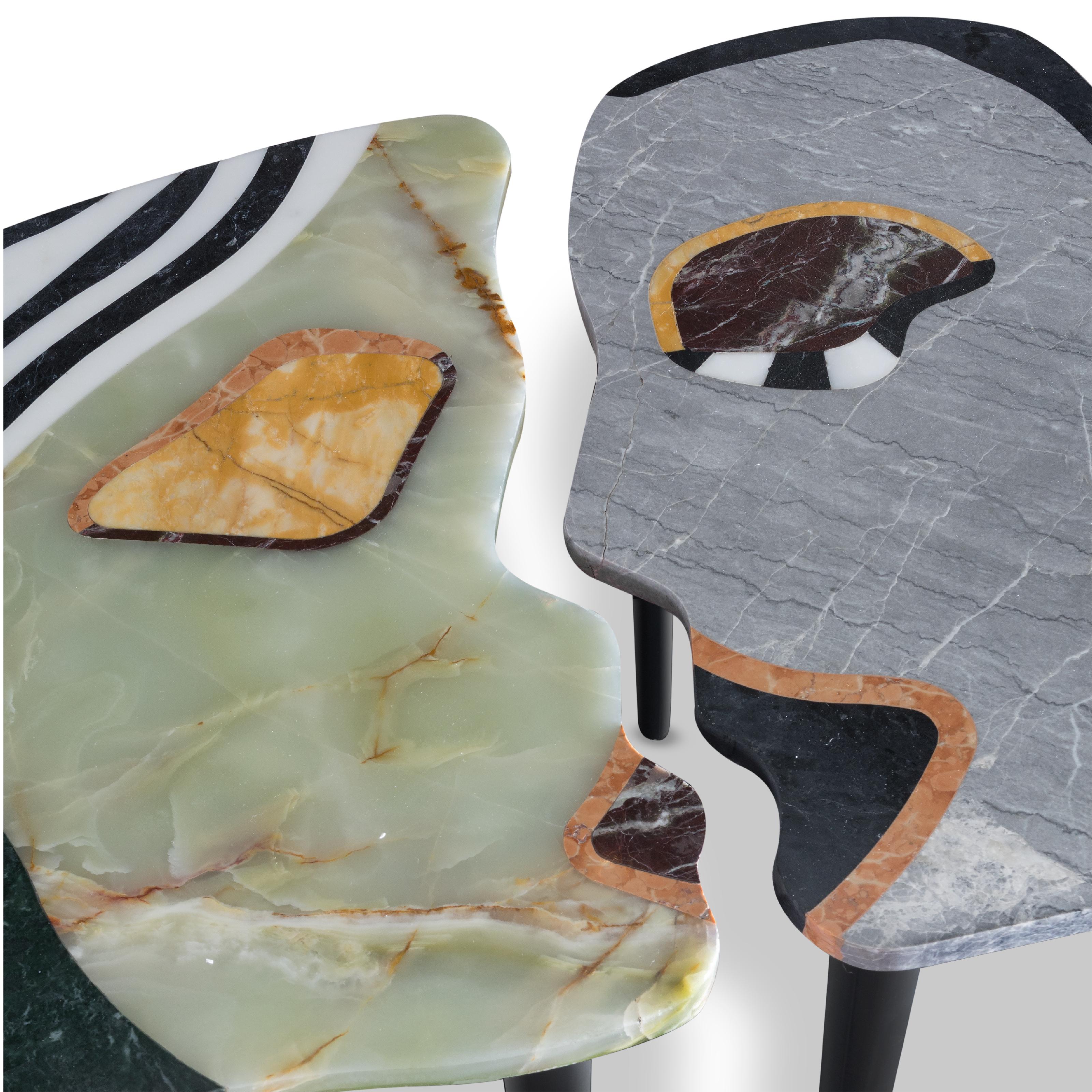 Artistic Man And Woman Face Marble And Metal Coffee Table 
woman and man face made of multicolor marble 
black, white and green marble
The “Inseparable” tables are just that: inseparable. They complement each other in a clever and understated