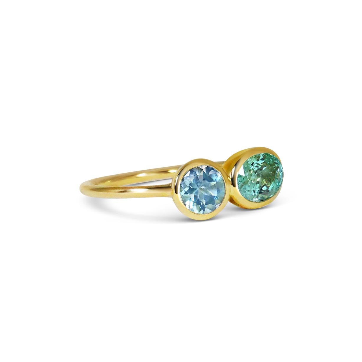 Designed as two birds singing next to one another this ring combines a colourful range of precious gems. Our signature hand pierced lace on the back of each gem allows light through the stones to reveal their natural beauty.

Certified in accordance
