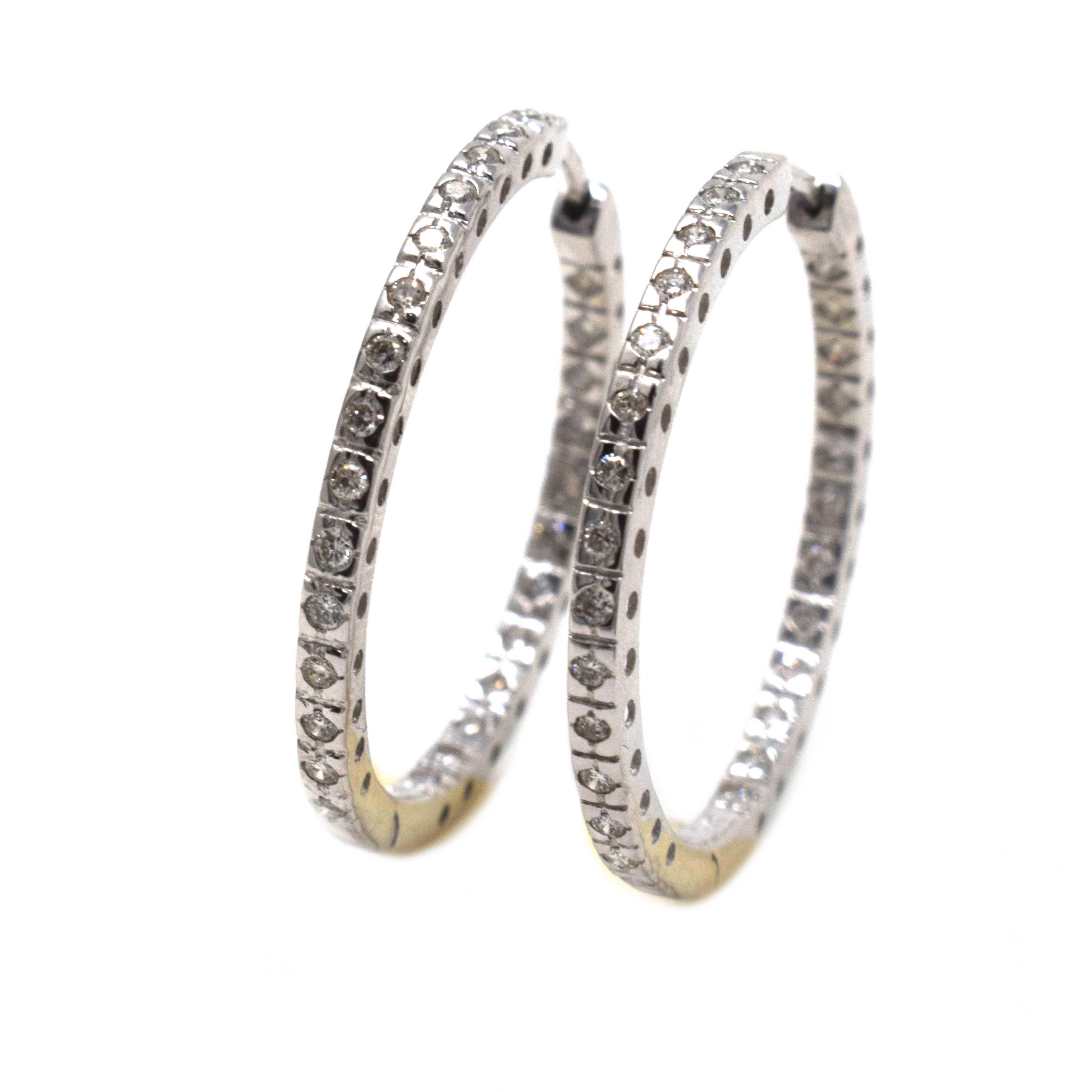 Brilliance Jewels, Miami
Questions? Call Us Anytime!
786,482,8100

Style: Hoop Earrings

Metal: White Gold

Metal Purity: 14k

Stones: 20 Round Diamonds (10 each earring)

Diamond Color: H

Diamond Clarity: I1/I2

Total Carat Weight: approx. 0.3 ct