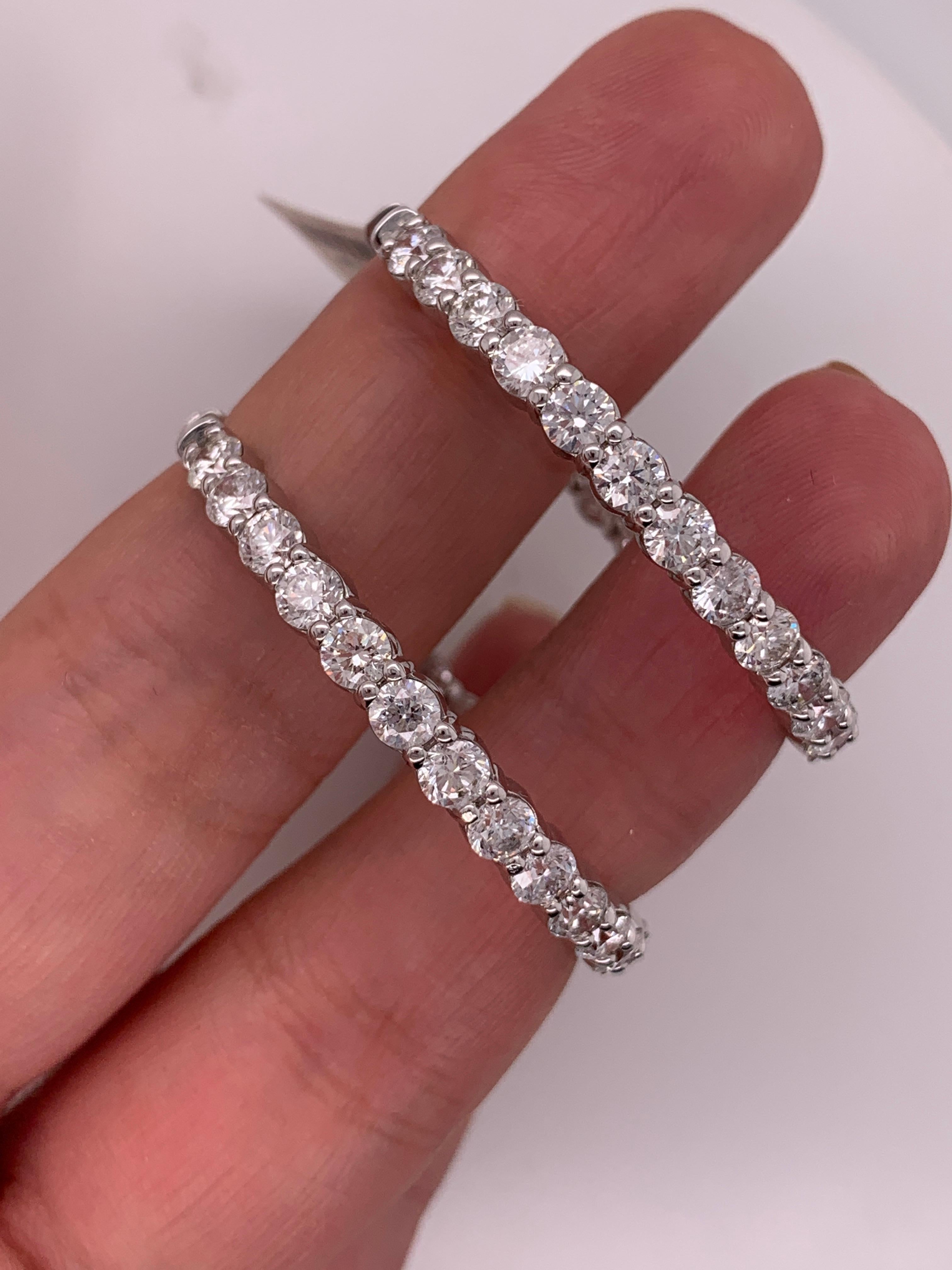 Absolutely stunning Inside out Diamond Hoop Earrings, very rare size. 
Features 11.00 Carats of Round Brilliant Cut Diamonds, 54 Round diamonds. 
1 1/2 