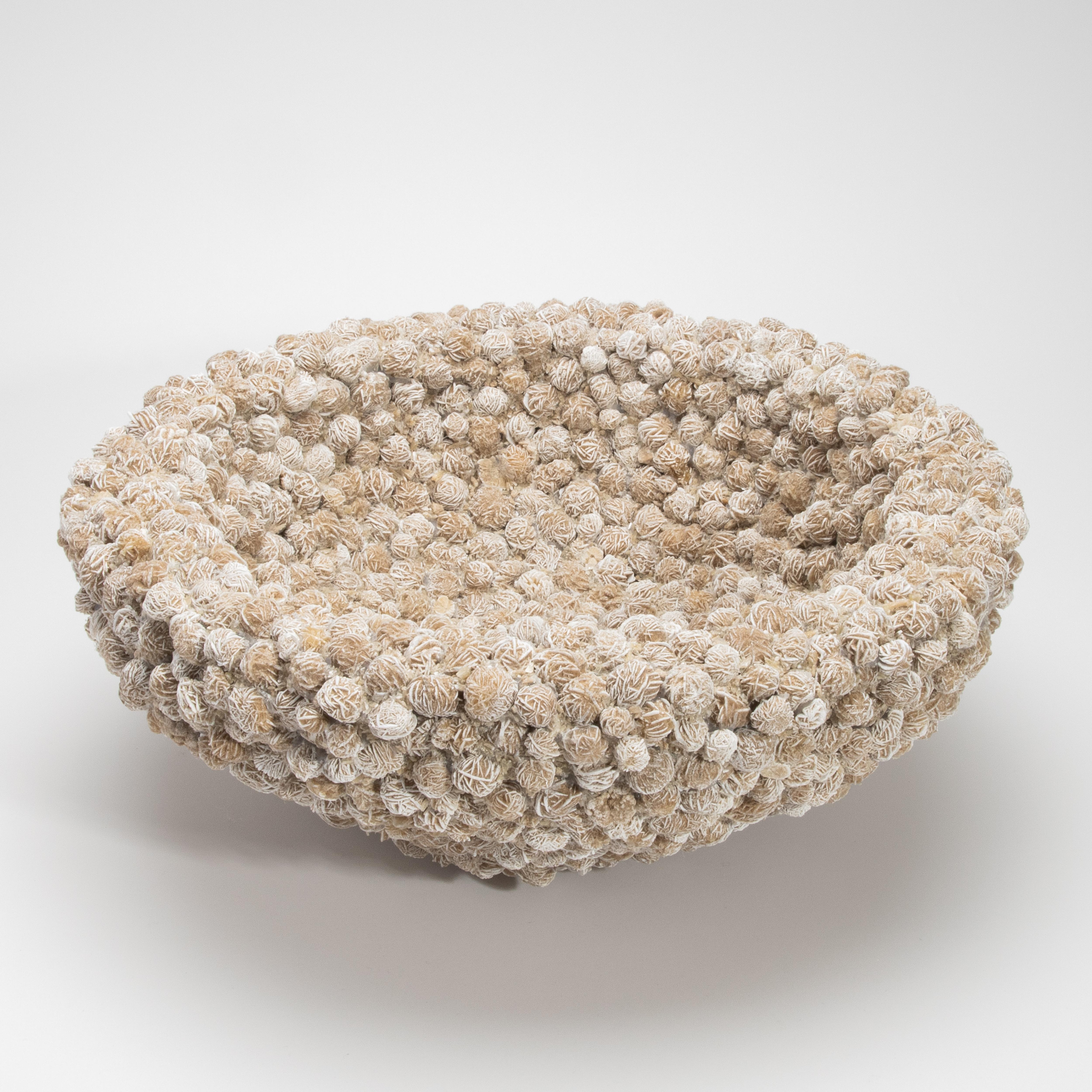 A sculptural treasure born from the raw elegance of nature, this Inside-Out Bowl by Kathryn McCoy is meticulously handcrafted from Desert Rose Selenite. Each individual mineral rosette—delicately layered in earthy tones of sand and ivory—is arranged