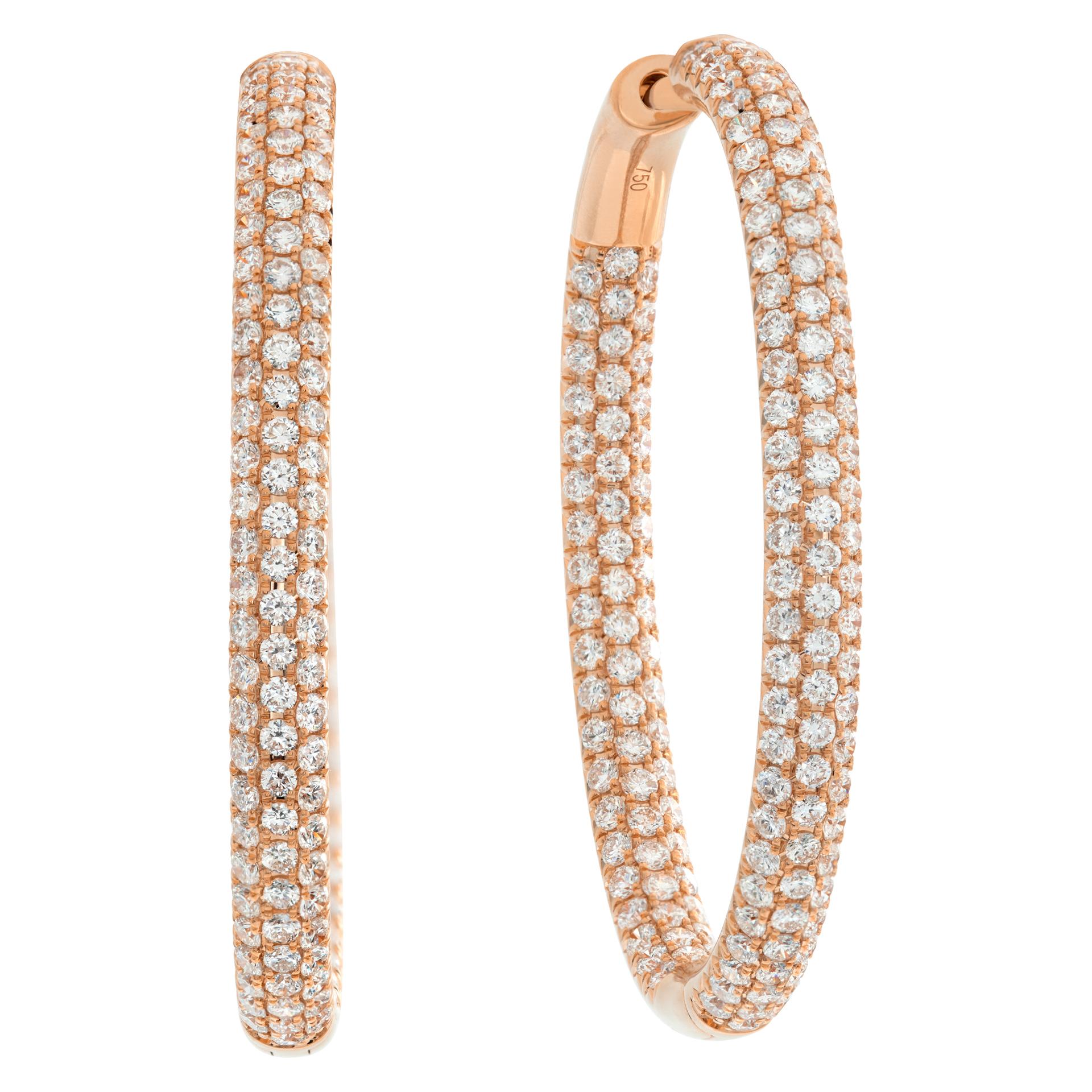 Stunning 18k rose gold inside out diamond oval hoop earrings with 5.63 carats in round cut diamonds (G-H Color, VS Clarity). Drop length: 1.75'', width: 0.15''.