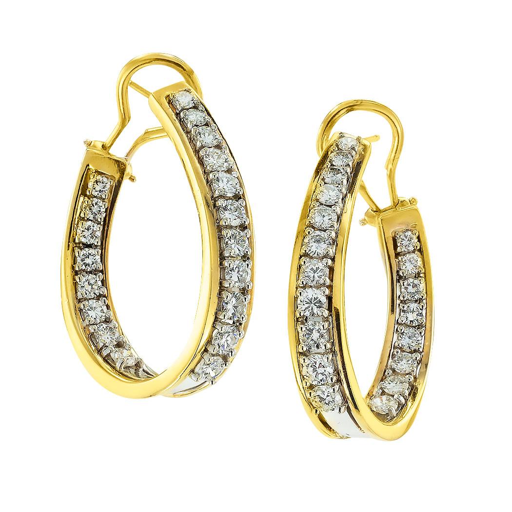 Inside-out diamond and gold hoop earrings circa 1980.  *

ABOUT THIS ITEM:  #E-DJ122A. Scroll down for specifications.  As seen in the photographs, these diamond hoops have double exposure on the diamonds.  Their semi-oval, twisted shape allows for