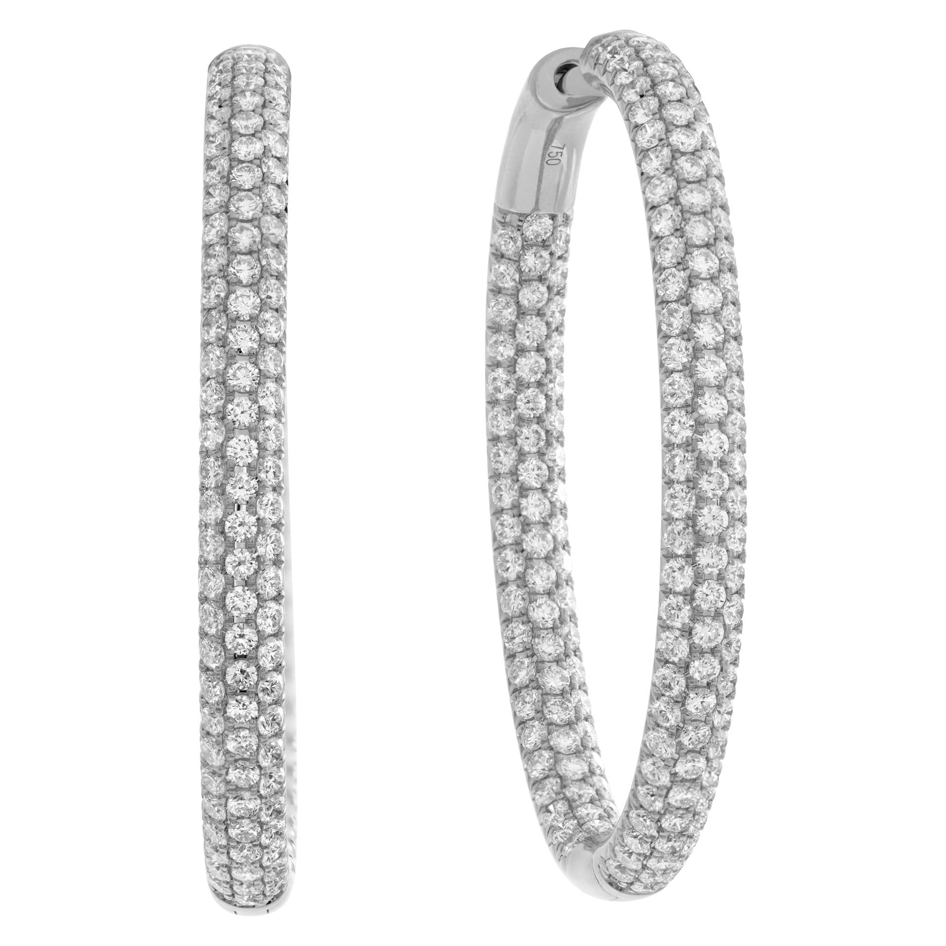 Dazzling 18k white gold inside out pave diamond hoop earrings with 5.63 carats in round diamonds (G-H Color, VS Clarity). Drop length: 1.75'', width: 0.15''.