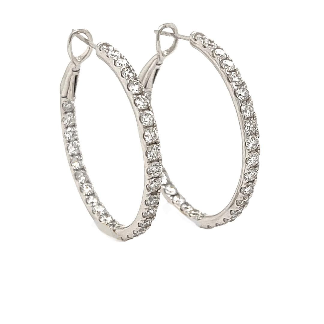 Just the right size, 2.67 cttw, inside-outside diamond hoop earrings.  VS-SI clarity and G-H color diamonds will dazzle your friends with diamonds showing in the front and back. Fifty Eighy round brilliant diamonds set in eight grams of 18 Kt white