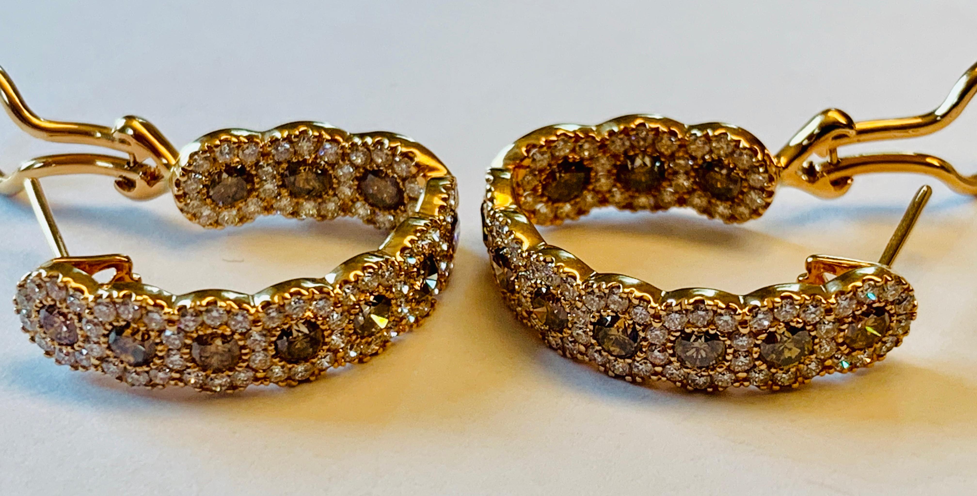 The epitome of understated elegance, these inside/outside hoop earrings in 18 K Rosegold feature 20 sparking round brilliant cut Champagne colored diamonds weighing 2.17 ct.,  and 168 white diamonds weighing 1.94 ct., all the diamonds are facing