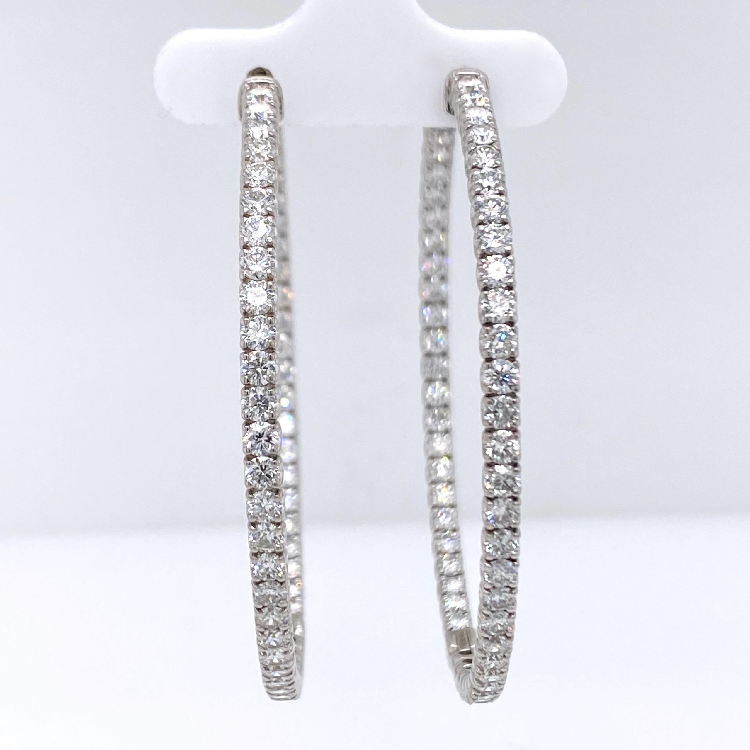 Diamond Hoop Earrings

Style:  Inside/Outside Diamond Hoops
Gold:  14K White Gold
TCW:  7.00 Carats Total Approximate
Diamond:  110 Round Brilliant Cut Diamonds 2.6mm
Color & Clarity:  F - G color, VS2 - SI2 clarity
Hallmark:  14K
Includes: 