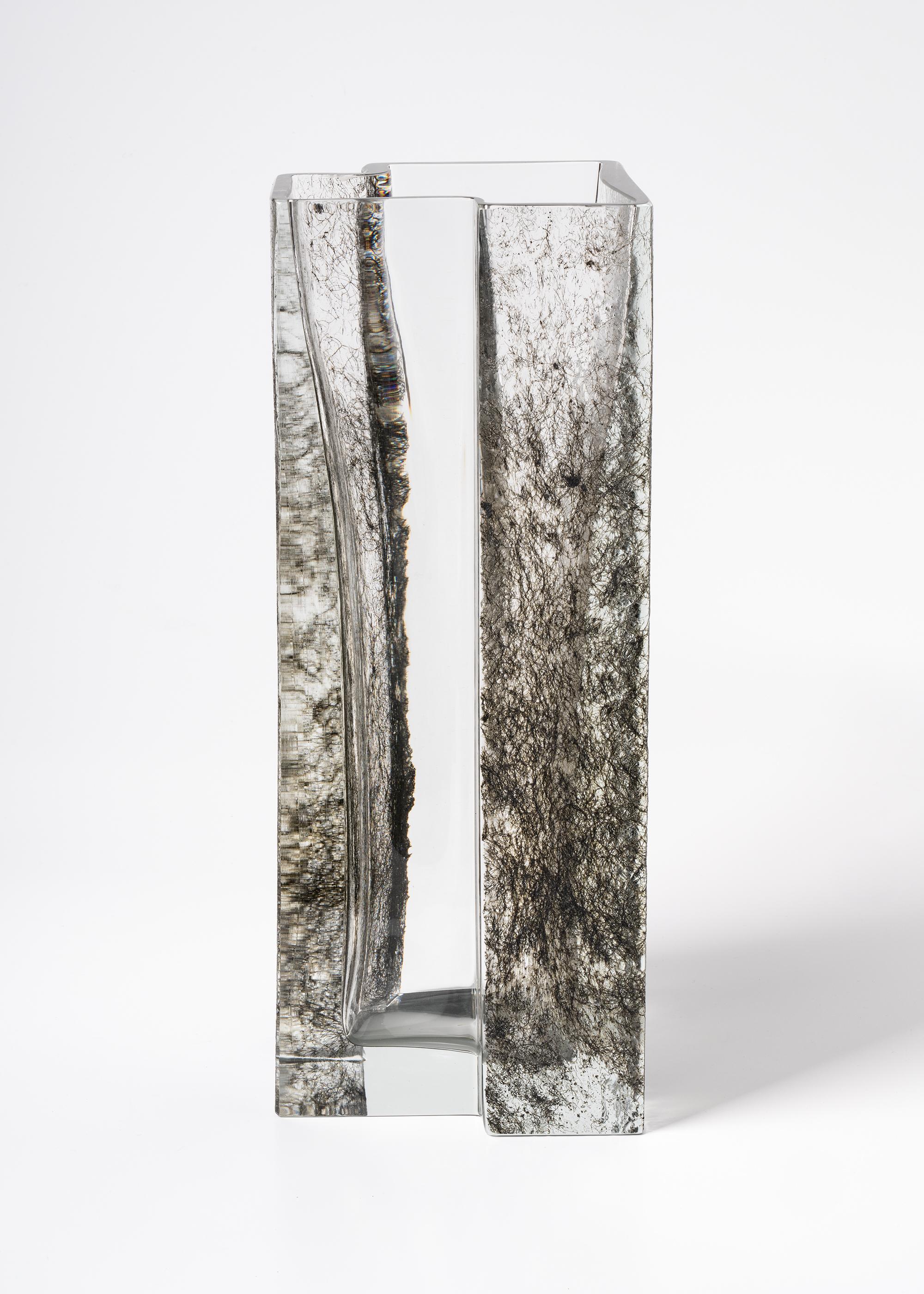 Inside the wood sculpted Murano glass vase by PAOLO MARCOLONGO 
2018
Dimensions: 42.2 x 16.1 x 16.6 cm
Materials: Murano glass, iron

Born in Padua in 1956, he attended the Art High School 