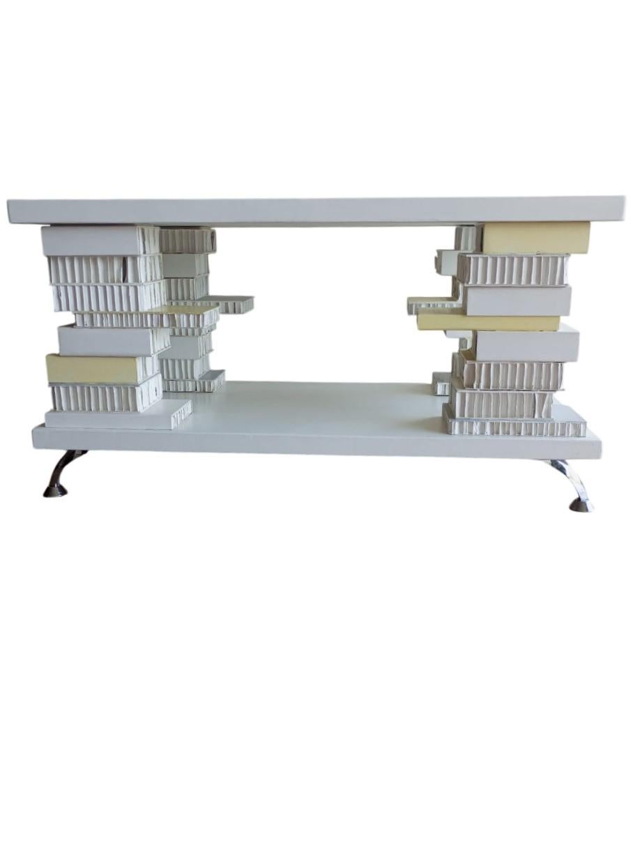 Italian handcrafted table with dimensions 121 cm. x 61 cm. x h 64 cm. worked in papier mache and wood.
The table has an artistic , modern and abstract design that makes it a sculpture. It has a smooth, white surface. It has a lower base that doubles
