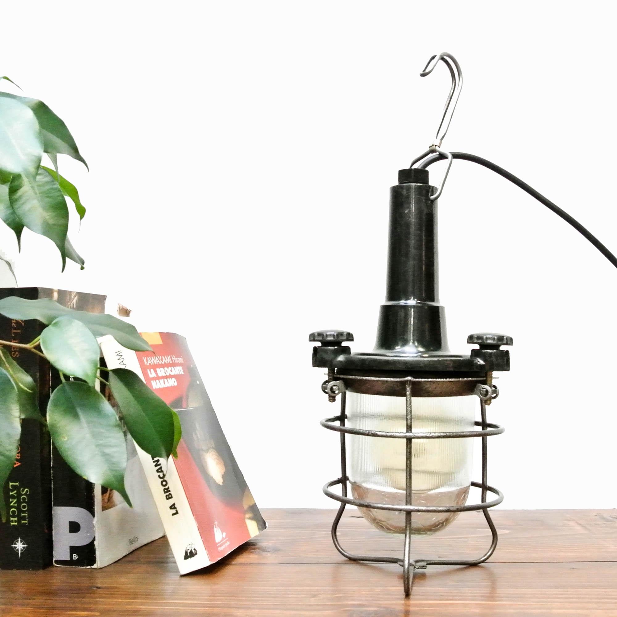 Very beautiful vintage portable lamp (origin: CCCP) made of black bakelite (stripped and polished). Opening system: 3 screws with head made of bakelite too. Nice beveled glass in 2 differents way giving a lovely lighting, protected by a grid