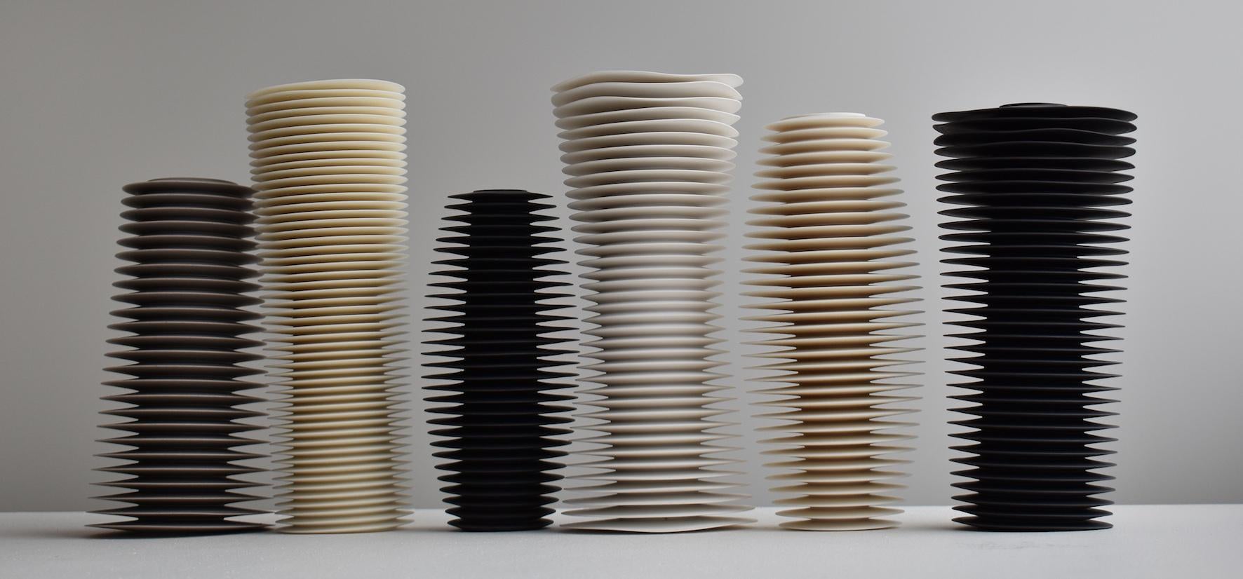 A six piece framed ceramic installation by acclaimed British ceramicist Nicholas Lees. The piece consists of six individually hand thrown and hand turned sculptures in parian porcelain, grey parian porcelain, bone china and black porcelain. These