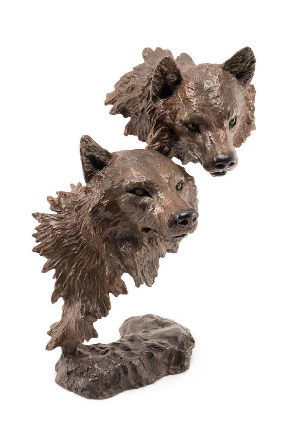 Presented is an original bronze Western wildlife sculpture by American artist Mark Hopkins. The bronze is titled “Instinct” and depicts two expertly sculpted wolf heads. Using the involved and lengthy method of lost-wax casting, “Instinct” captures