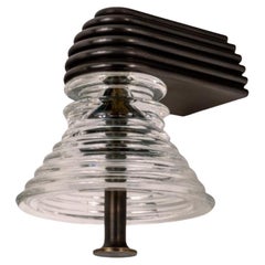 Insulator A Clear Glass and Dark Brass Sconce by Novocastrian