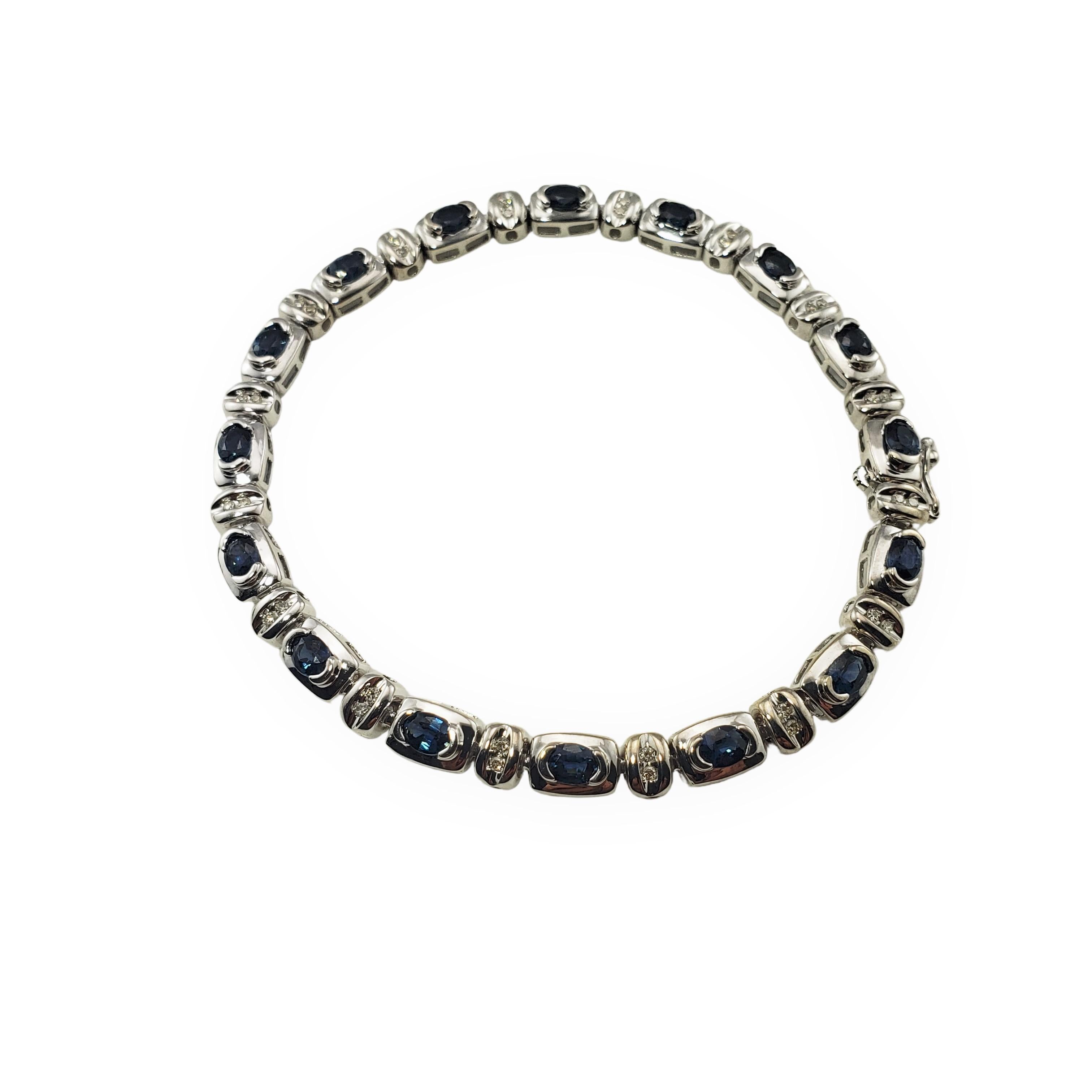 Vintage 14 Karat White Gold Sapphire and Diamond Bracelet-

This lovely bracelet features 32 round single cut diamonds and 15 oval blue sapphires (4 mm x 3 mm each) set in classic 14K white gold.  Width:  5 mm.

Approximate total diamond weight: 