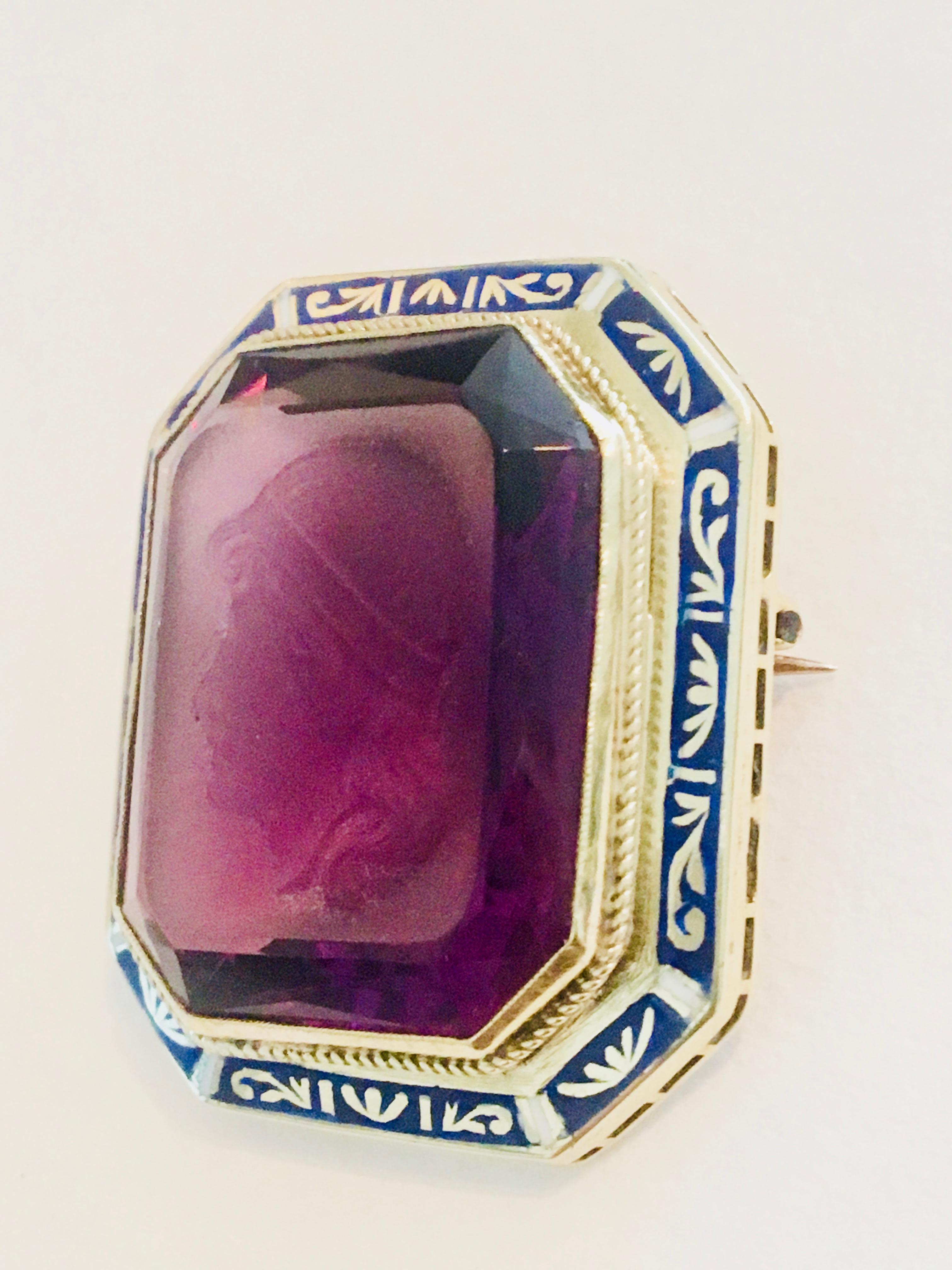 Intaglio Amethyst Pendant/Pin 14k Yellow Gold with Cobalt Blue and White  Enameled Bezel with a Grecian Style profile.  

Amethyst stone dimensions -  21x26x11