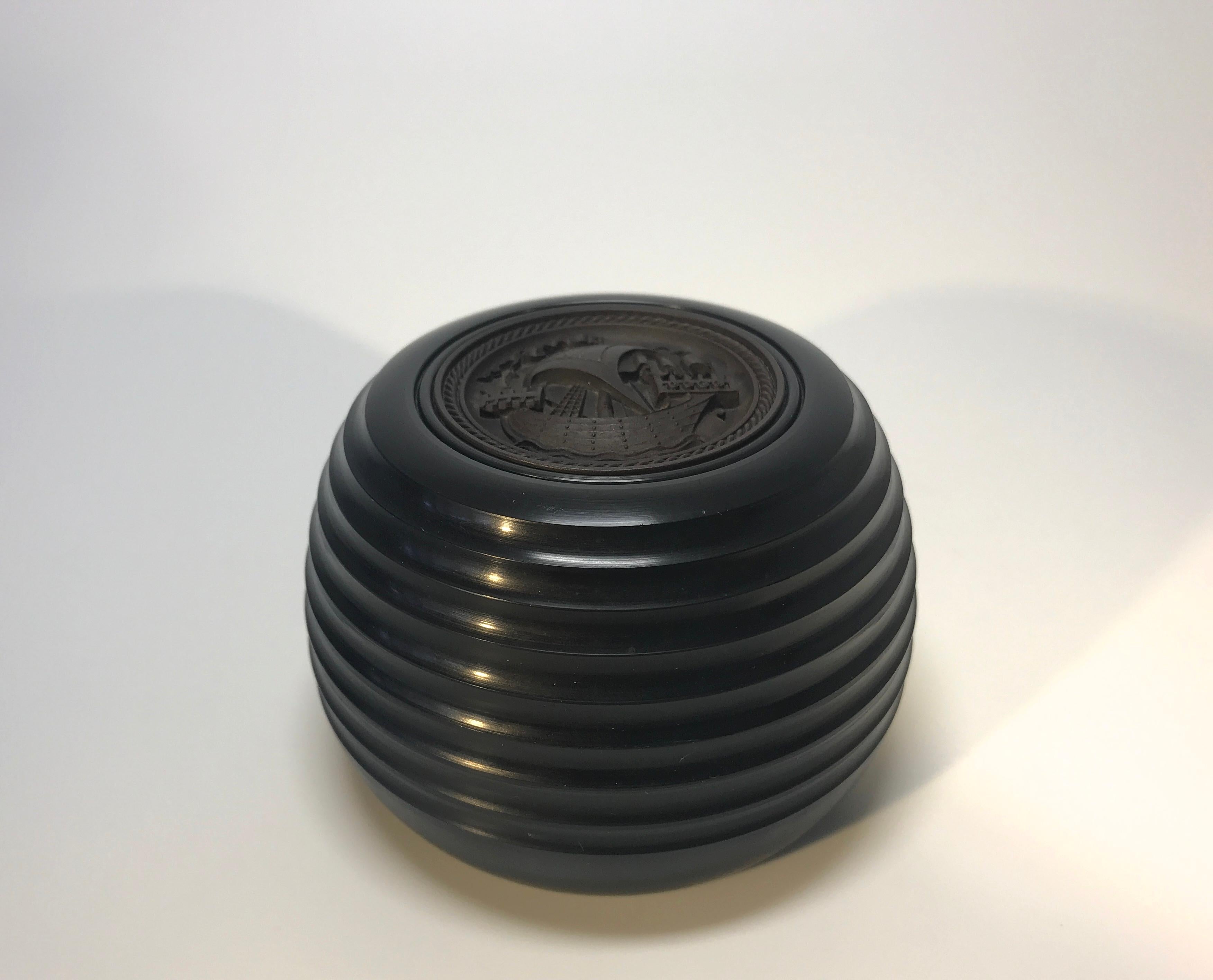 Superb cameo of an ancient sailing ship, inset on a heavy black polymer beehive shaped turned base
Inset underneath is a magnetic disc for paperclips
Retro maritime desk accessory,
circa mid-20th century
Measures: Height 2 inch, diameter 3