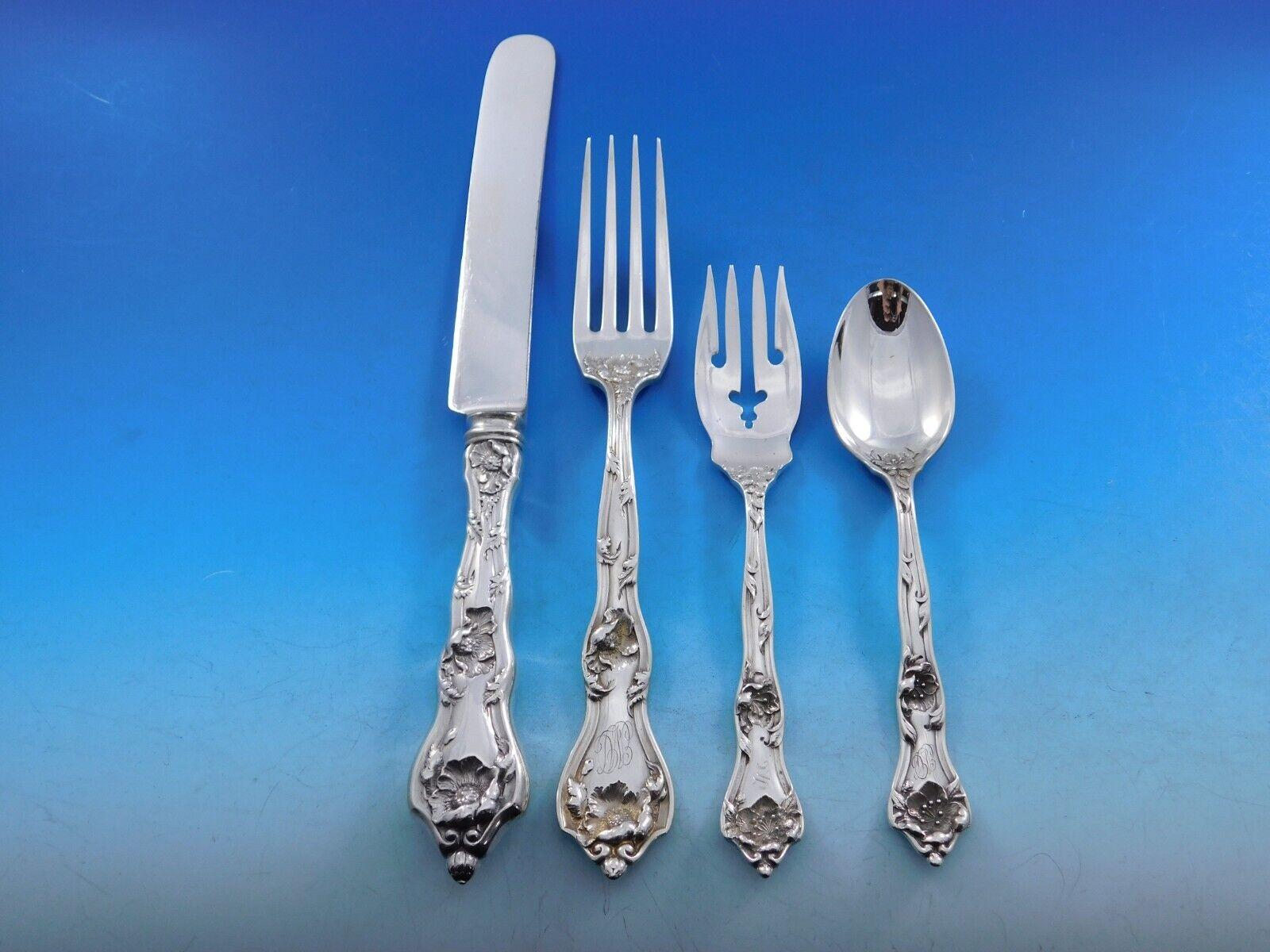 This floral multi-motif pattern was introduced by Reed & Barton in the year 1905. 
Intaglio by Reed & Barton sterling silver Dinner Size Flatware set - 85 pieces. This set includes: 
 
12 Dinner Size Knives, 10 1/4