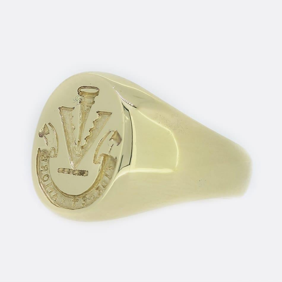 This is a 14ct yellow gold signet ring. This signet ring has an oval face with an intaglio of a symbol and the words 'fide et amore' which translates from Latin as 'with faith and love'.

Condition: Used (Very Good)
Weight: 12.7 grams
Size: N