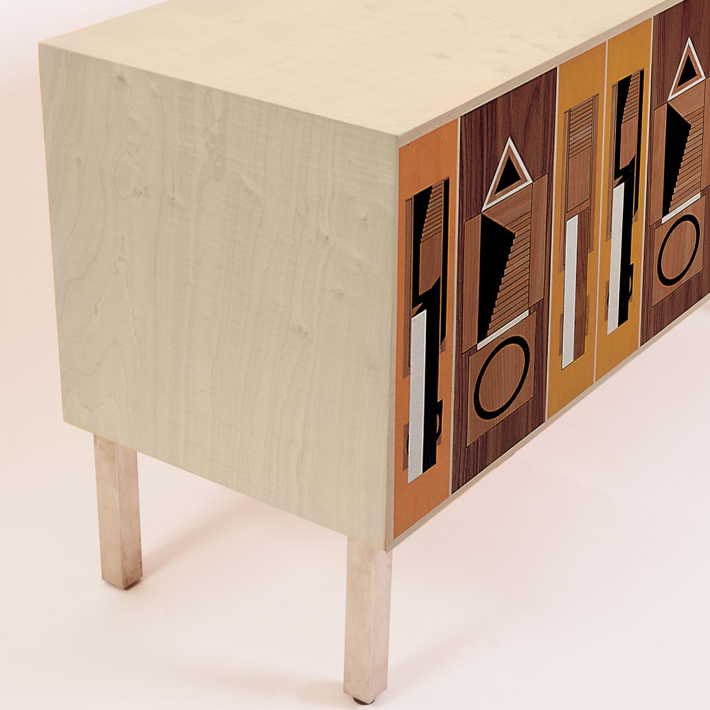 Retro motifs and soft grainy hues abound in this wood sideboard designed by Aldo Rossi and handcrafted by the skilled carpenters of Laura Meroni, using poplar and maple wood veneer. The doors open to reveal adjustable shelves, and an adjustable base