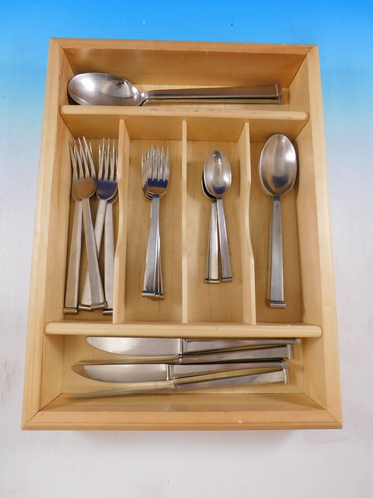 Rare Integrale by Christofle stainless steel flatware set with unique, modern design - 22 pieces. This pattern was discontinued in the year 2004. This set includes:

4 Knives, 9 1/4