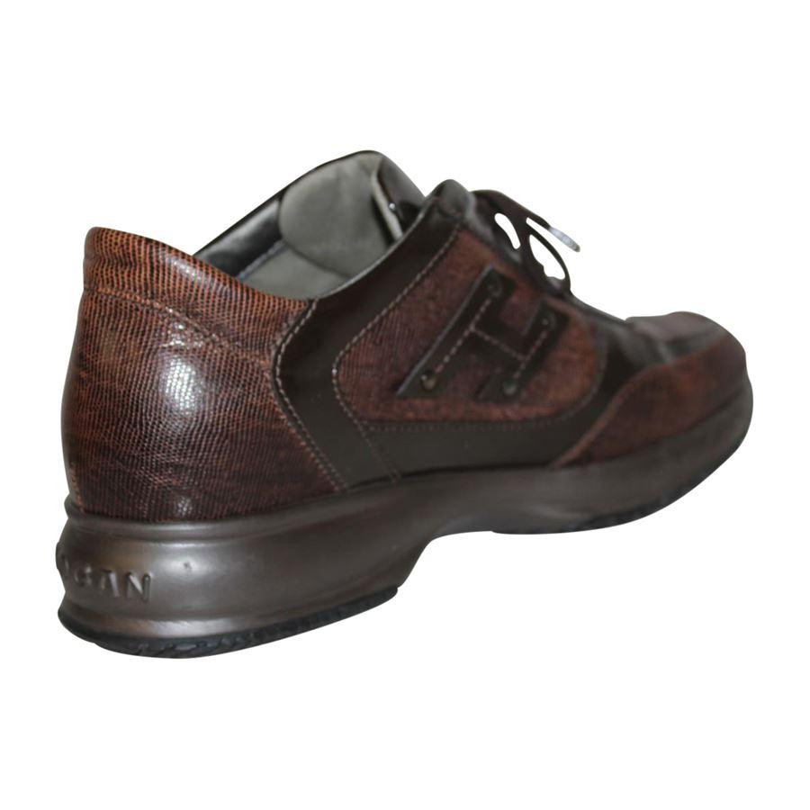 Model Interactive Leather and patent Brown Laced Embossed H on sides with studs Rubber outsole

