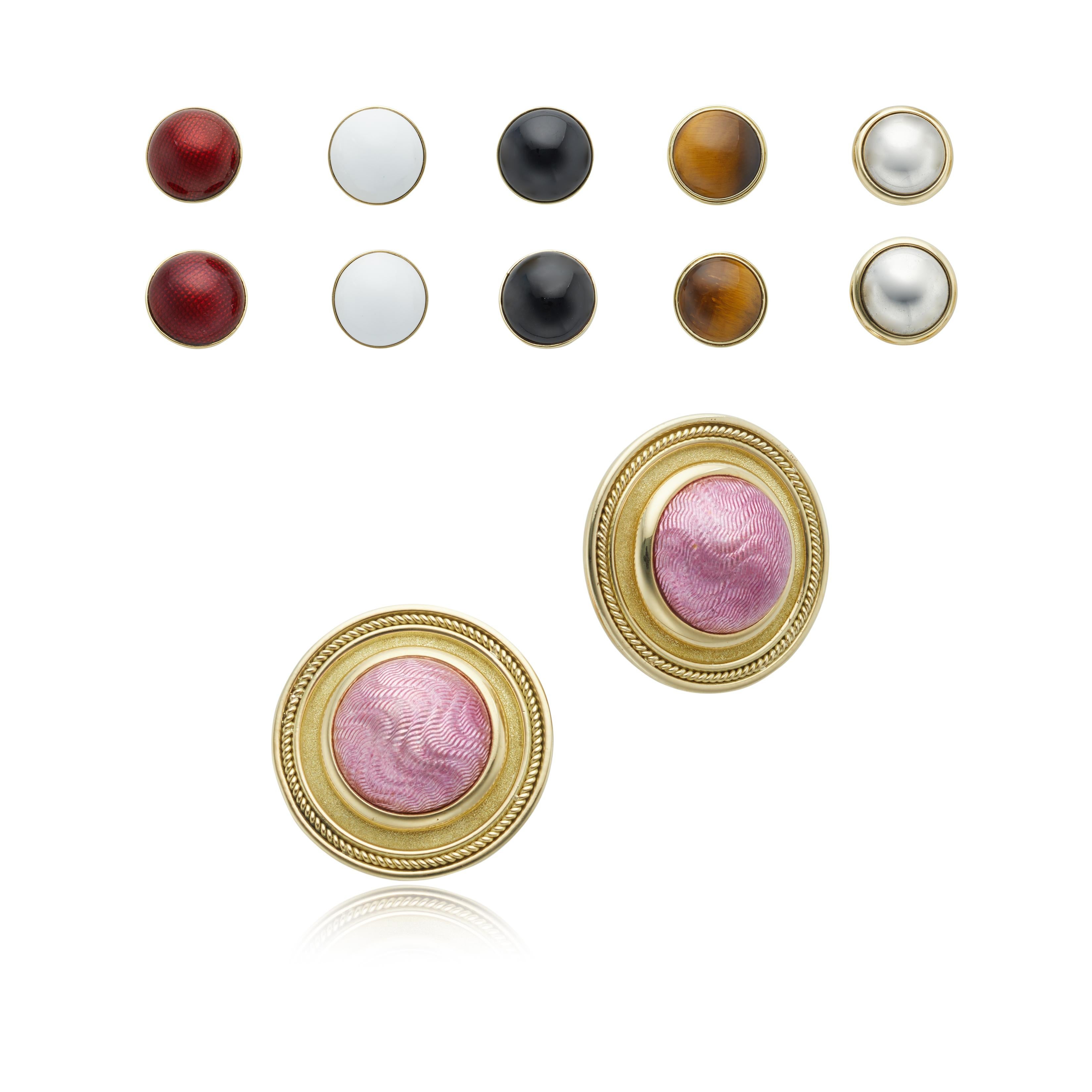 These 18 karat yellow gold “whiteside” clip earrings come with seven interchangeable round enamel centers; including colors such as pink, white, black, red, silver, gold and tiger’s eye. 