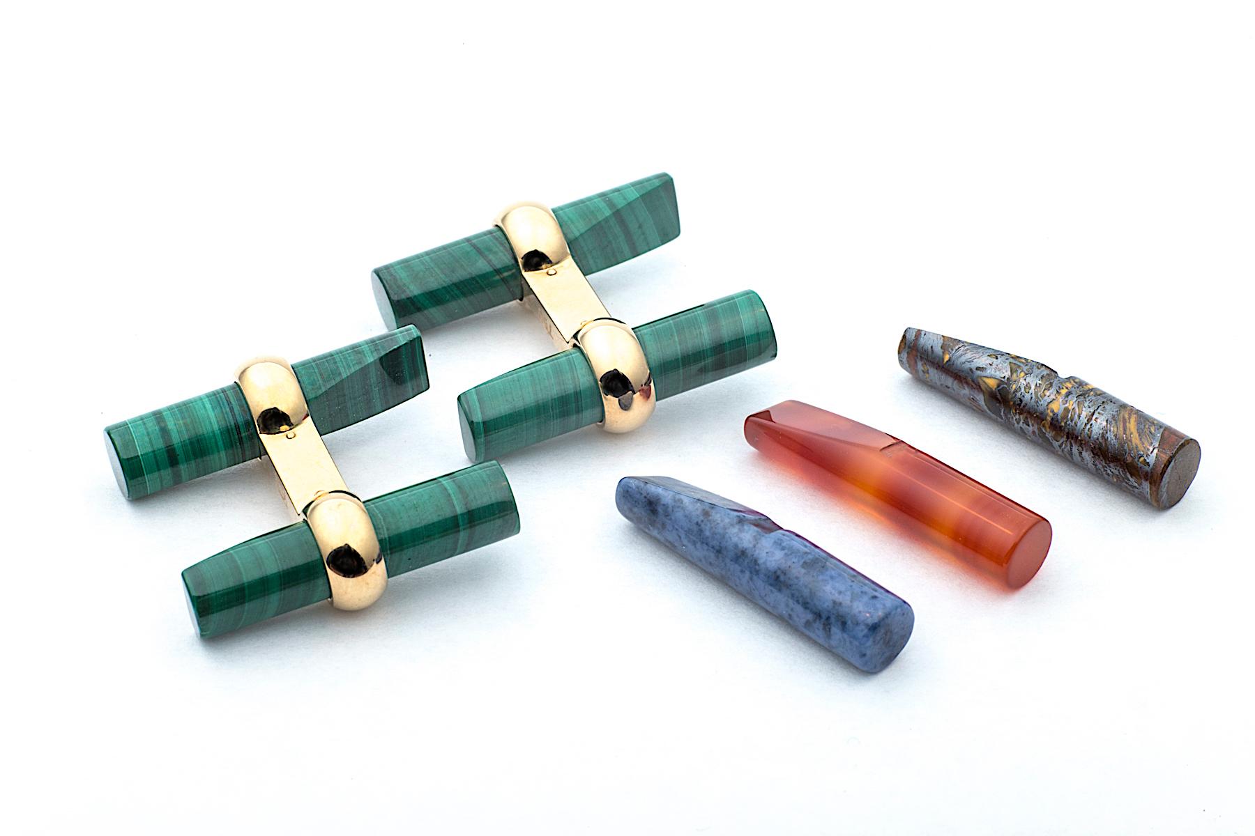 Pass the baton and win the race with these handmade interchangeable natural colored stone cufflinks!  With four different baton shaped stones in handsome tiger iron (black/brown), malachite (green), Indian carnelian (deep coral), and dumortierite