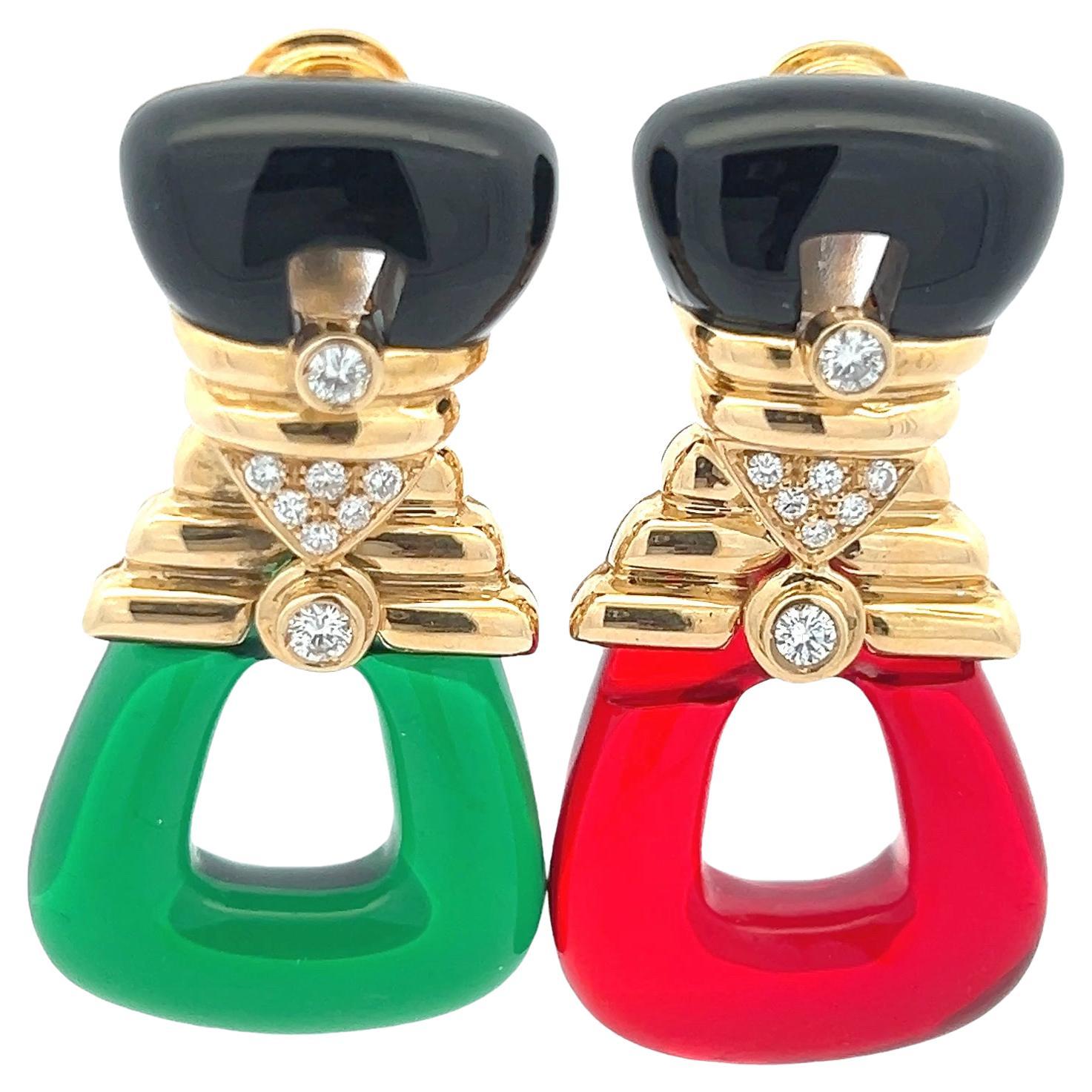 Striking and luxuriously versatile, these chandelier earrings are crafted in rich 18K yellow gold and set with approximately 1.2 carats of brilliant-cut diamonds. The design features interchangeable drop elements in red, green, and golden-yellow