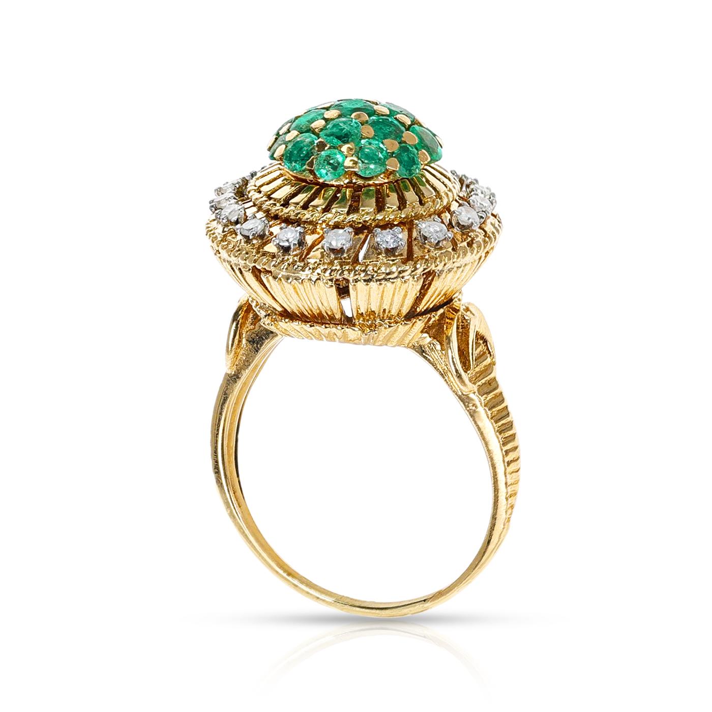 A multi-purpose cocktail ring with an interchangeable center of ruby and emerald. There are diamonds accented around the center of the ring. The ring is crafted in 18 Karat Yellow Gold. The ring size is US 9.50. The total weight of the ring is 13.91