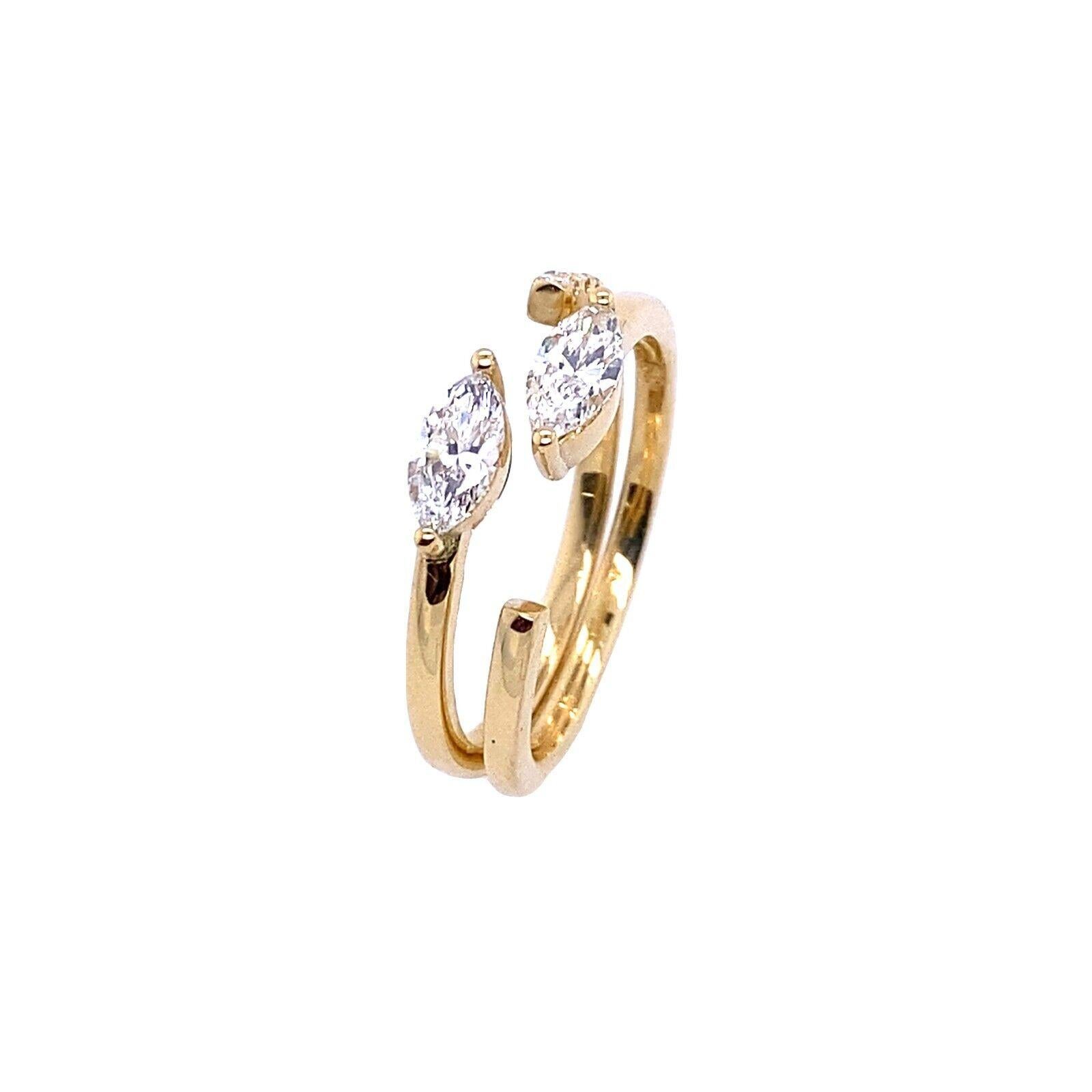 This pair of matching marquise and round diamond rings are crafted in 18ct yellow gold.One ring is plain band with one marquise and the is ring is set in pave diamond band. The settings are open on sides to allow you to slide the ring over other and