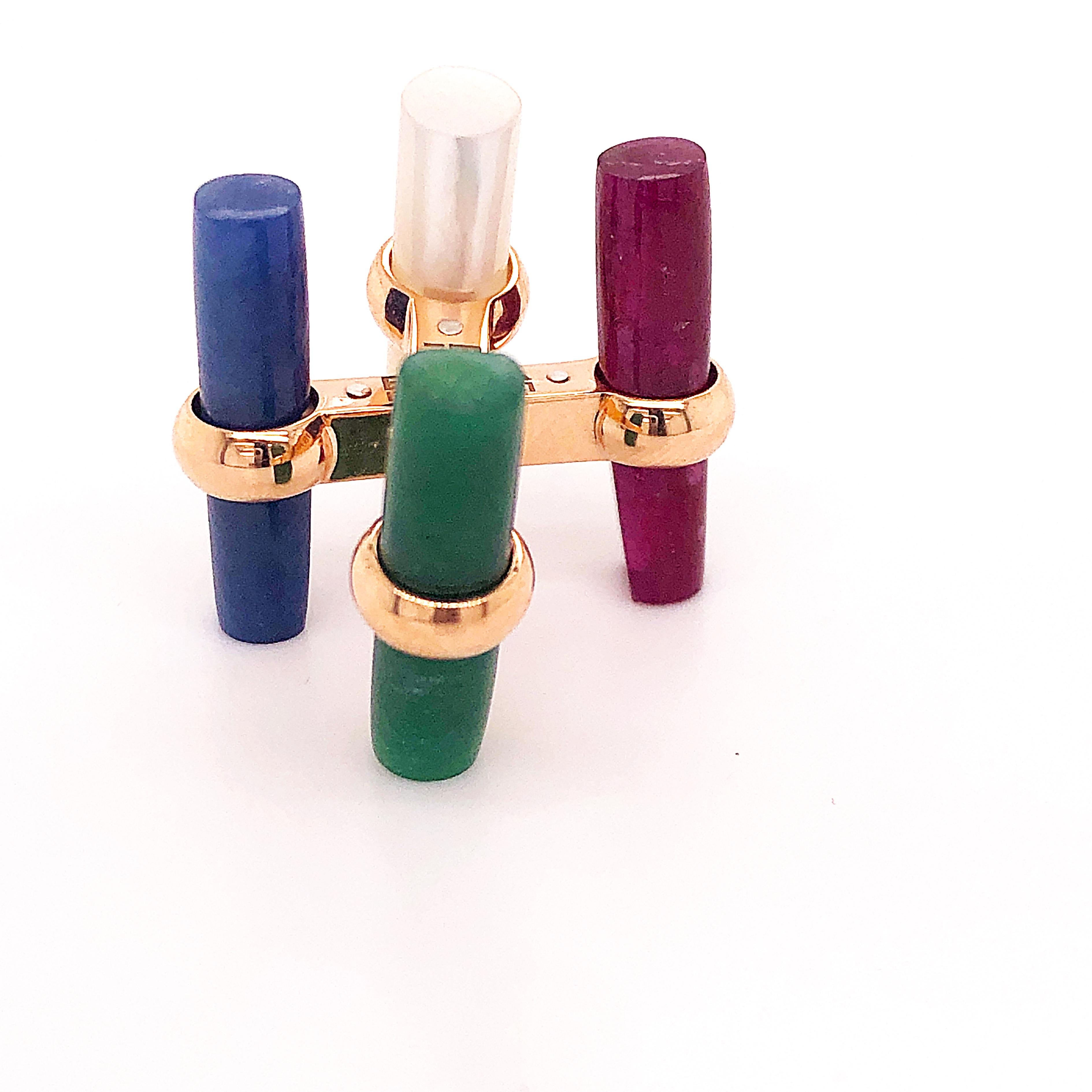 One-of-a-kind, Interchangeable Natural Precious Stones Set Cufflinks featuring 24.13 Kt Natural Blue Sapphire, 24.67Kt Ruby, 16.78Kt Green Jade, 14.5Kt White Moonstone Hand Inlaid Batons in an 18K Rose Gold Setting; a fitted Burgundy Leather Case