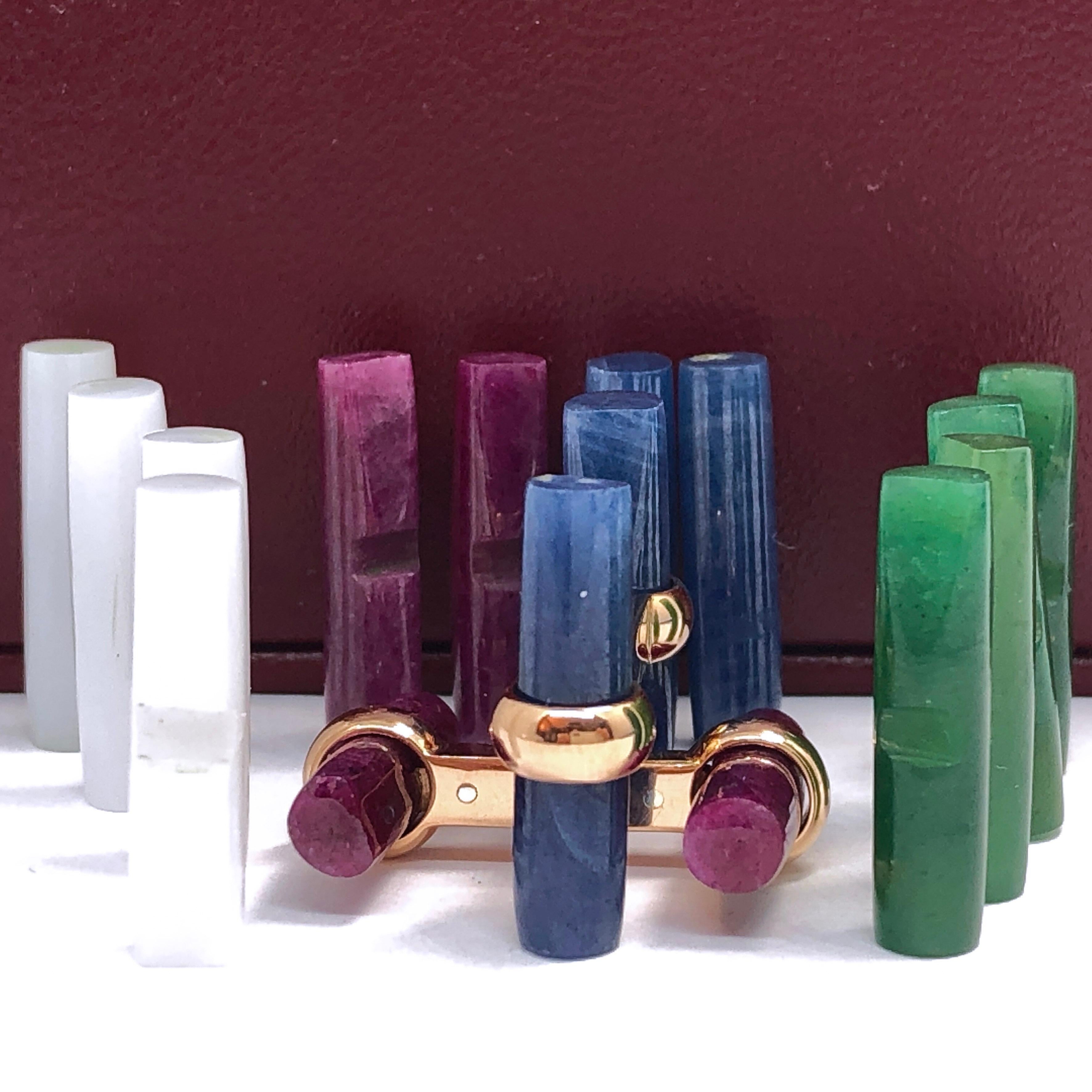 Interchangeable Natural Precious Stones Set Cufflinks featuring 24.13 Kt Natural Blue Sapphire, 24.67Kt Ruby, 16.78Kt Green Jade, 14.5Kt White Opal Hand Inlaid Batons in an  18K Yellow Gold Setting; a fitted Burgundy Leather Case completes this