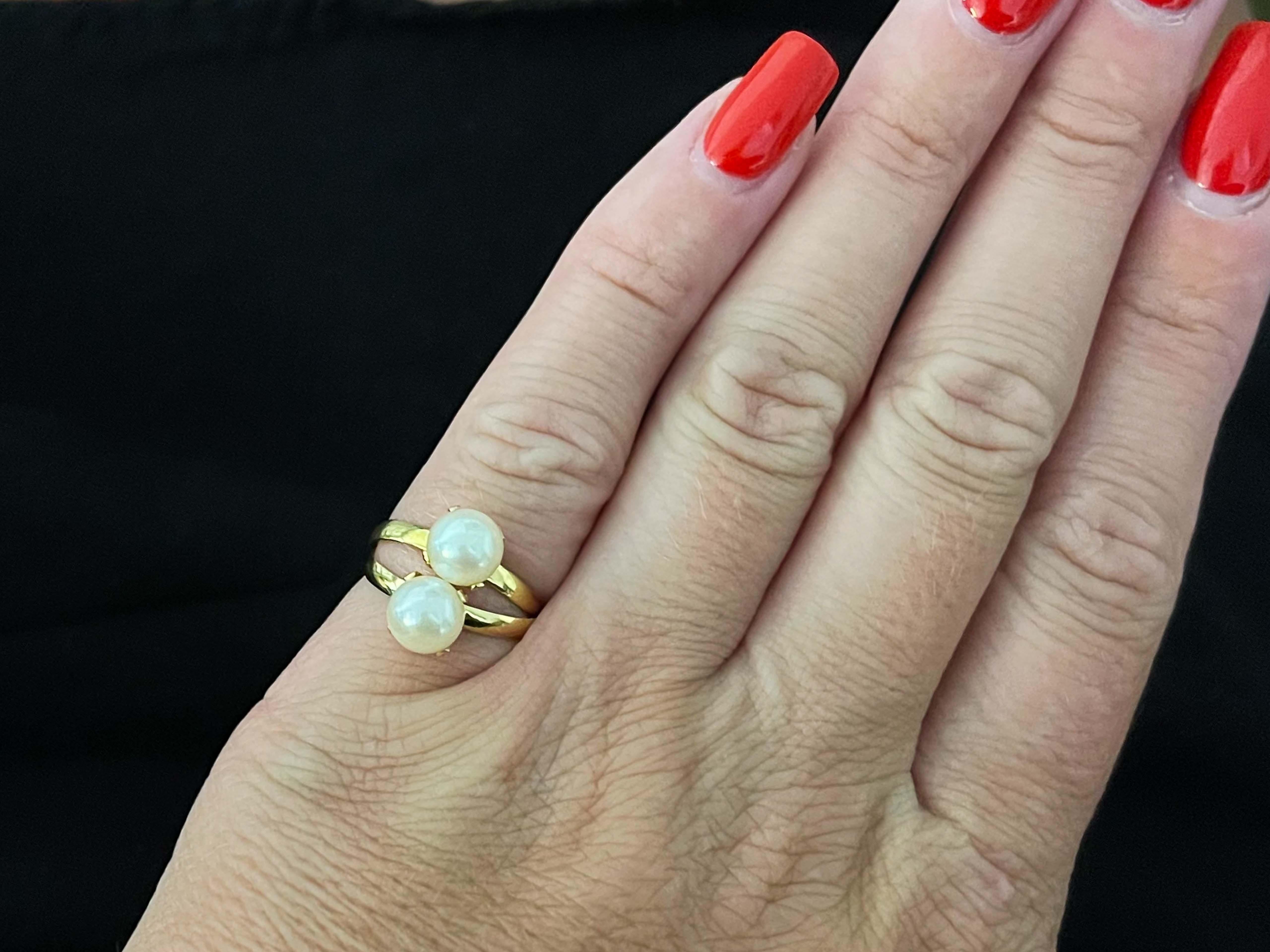 Item Specifications:

Metal: 18K Yellow Gold 

Total Weight: 2.8 Grams

Ring Size: 5.5 (resizable)

Gemstone Specifications:

Gemstone: 2 Akoya Pearls

Pearl Diameter: 6.7 mm

Condition: Preowned, Excellent

Stamped: 