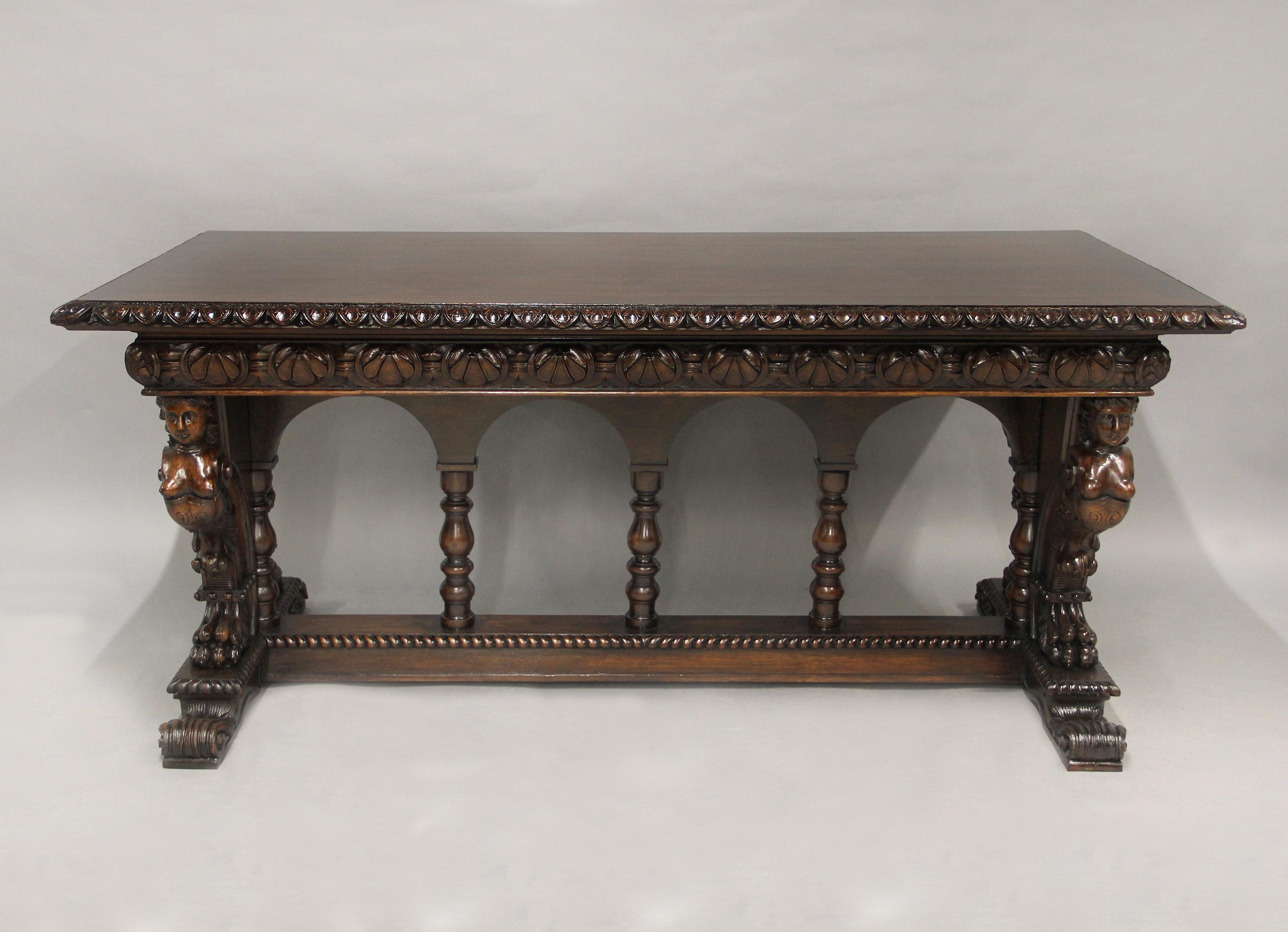 An Interesting Late 19th Century American Renaissance Style Hand Carved Oak Refectory Table

The rectangular top with stiff-leaf edge and anthemion carved frieze, the end supports richly carved with a large eagle with wings spread, between female