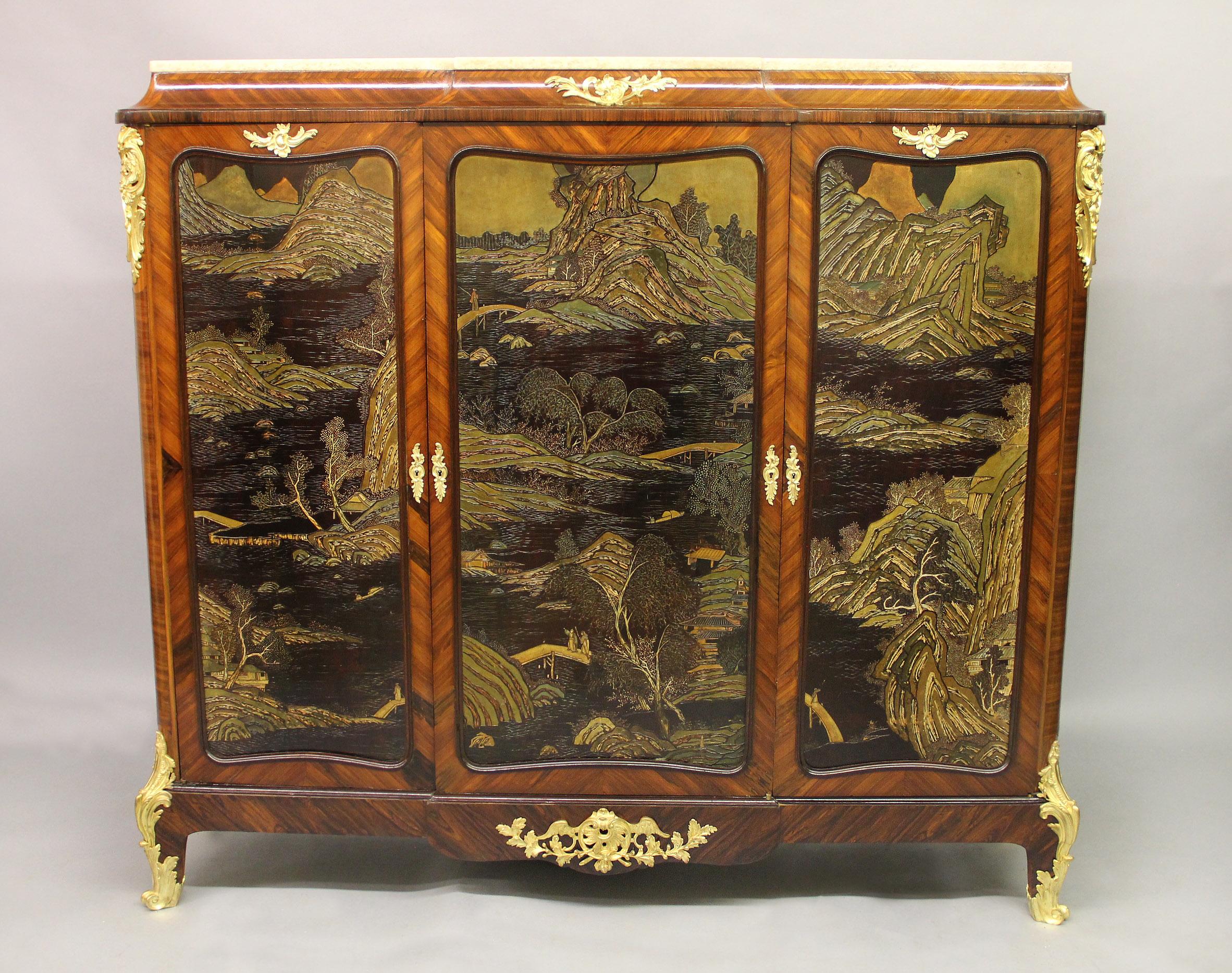 An Interesting late 19th century gilt bronze mounted Transitional style Chinoiserie cabinet by L. Bontemps

L. Bontemps

Marble top above three high doors, each with a coromandel landscape scene with people at leisure, the sides quarter