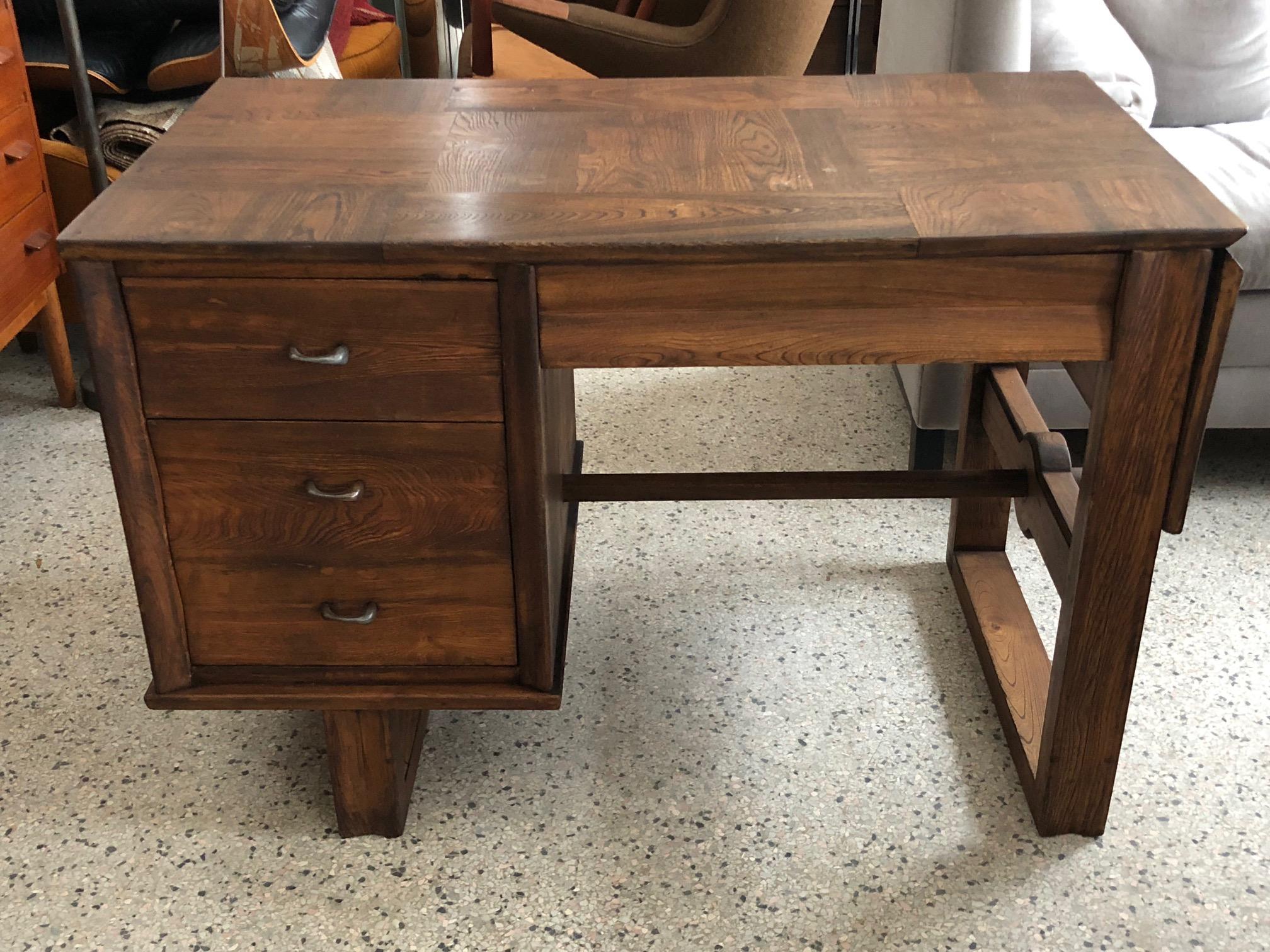 An unusual small desk with drop front by Ray See for See Mar, circa 1950s. Measures 43.35