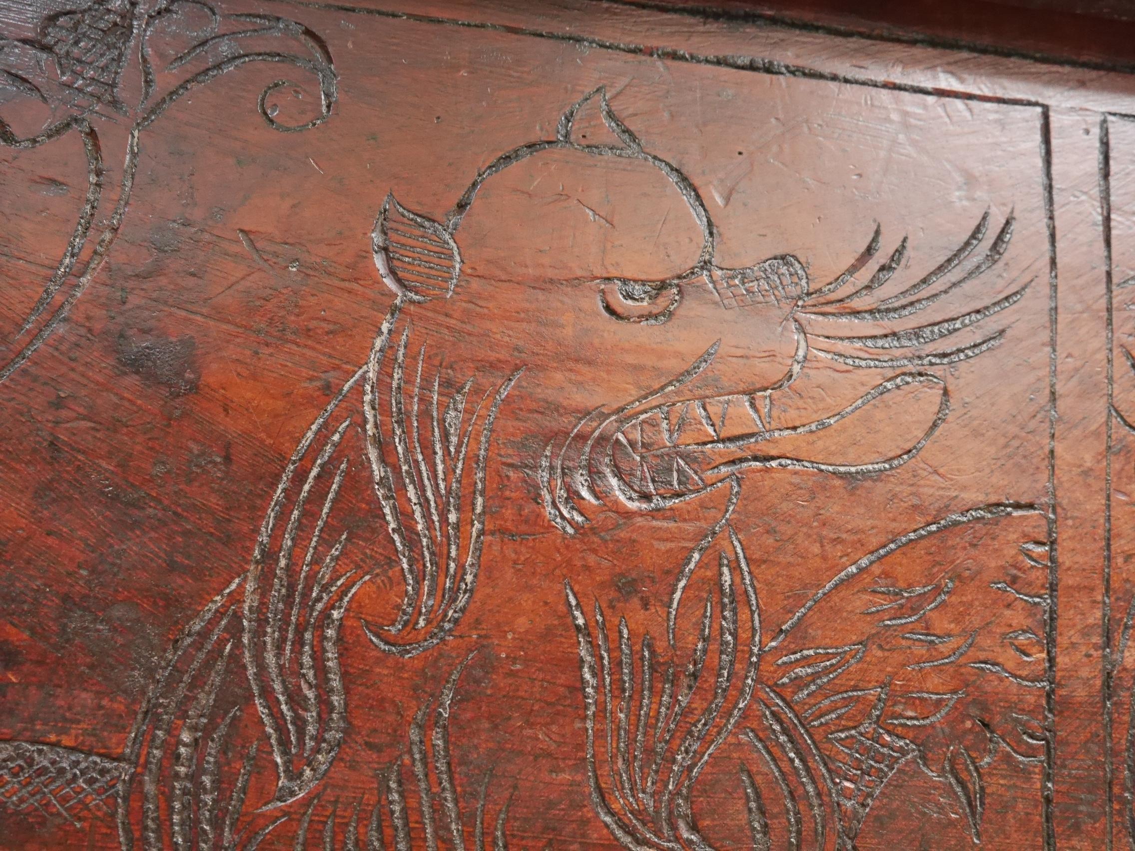 A large 17th century carved coffer.
A highly unusual & early example with all original cedar panels, the front carved with some wonderful & very interesting floral detailing to the centre flanked by a fantastic pair of naïve stylised lions. 
With a