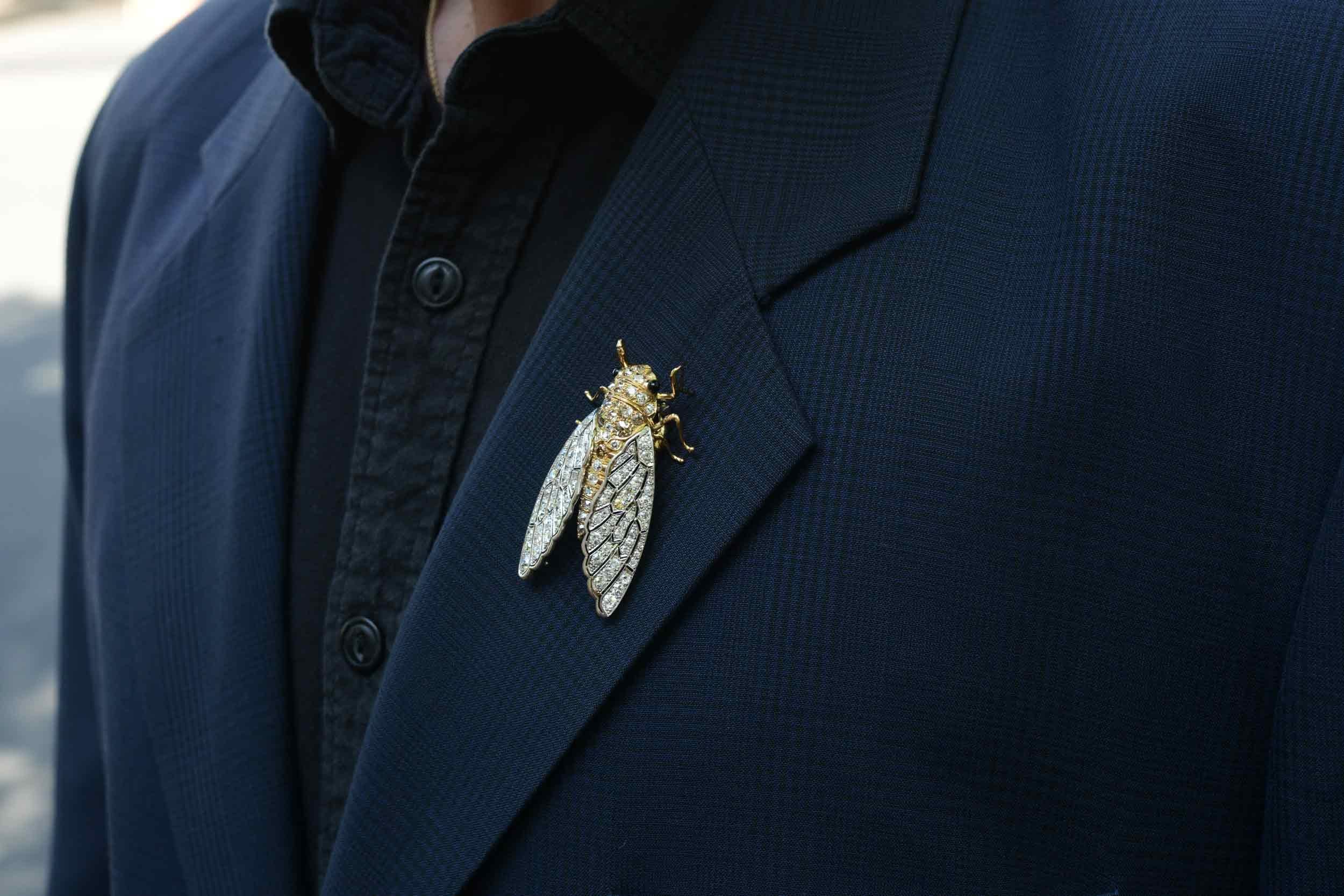 This Victorian era brooch pin is a stunning piece of early 1900s antique insect jewelry. The curious cicada expertly crafted of 18 karat gold and platinum, the pin overflows with 2 carats total of antique cut diamonds - guaranteed to make a
